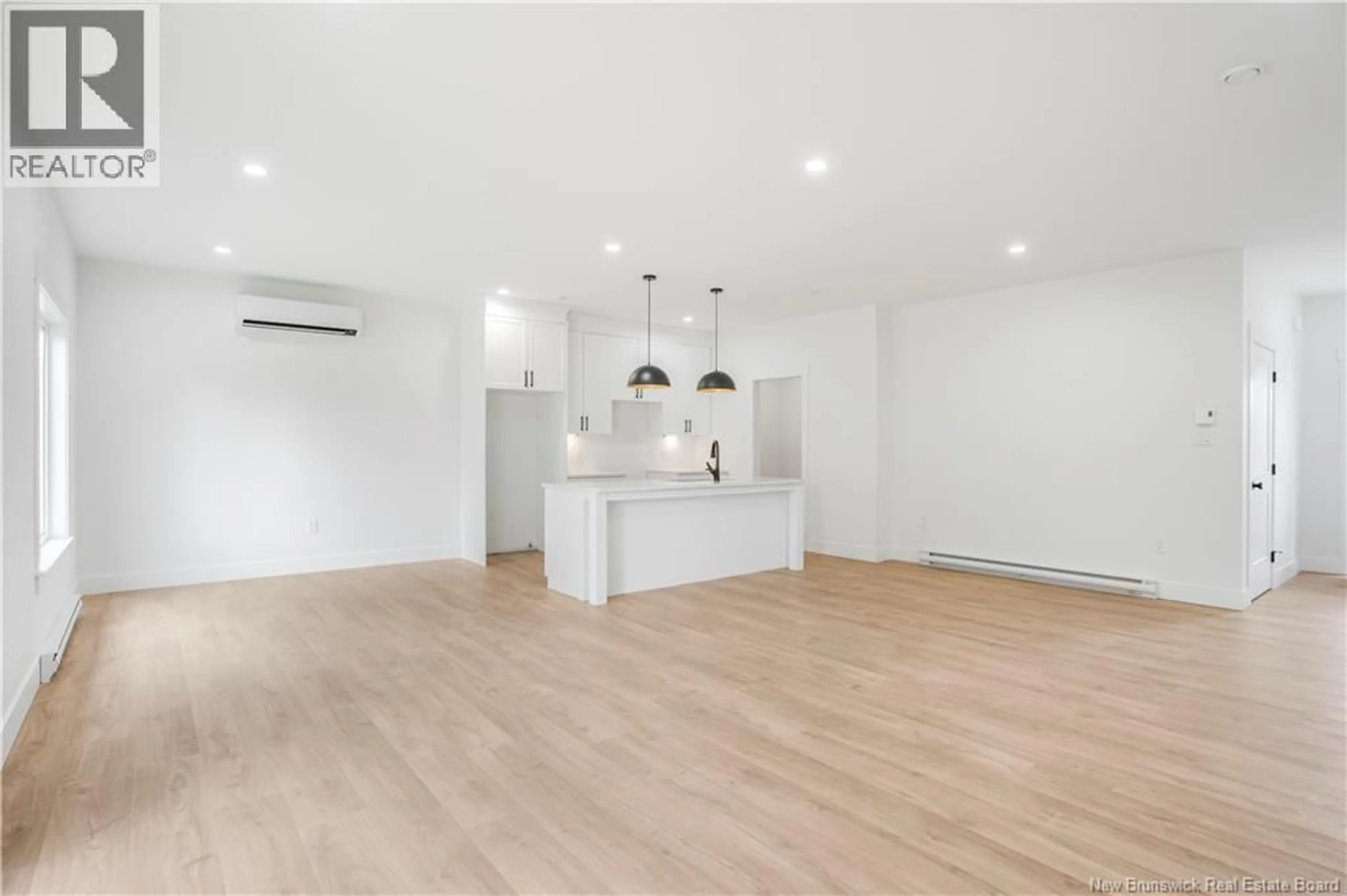 Open concept kitchen, wood/laminate floor for 8 SANDCHERRY LANE, New Maryland New Brunswick E3C0M4