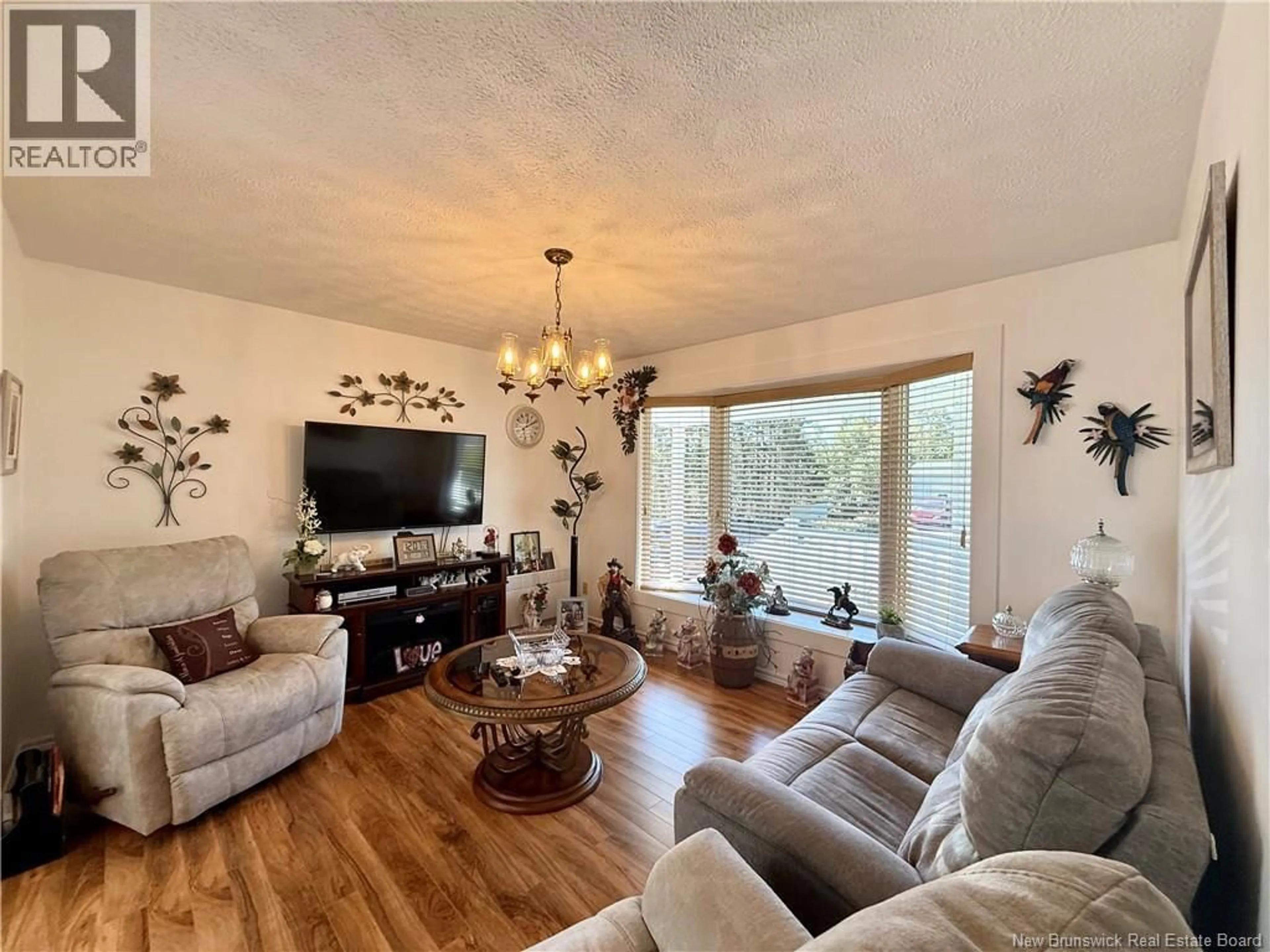 Living room with furniture, wood/laminate floor for 95 DES ÉRABLES AVENUE, Clair New Brunswick E7A2B9
