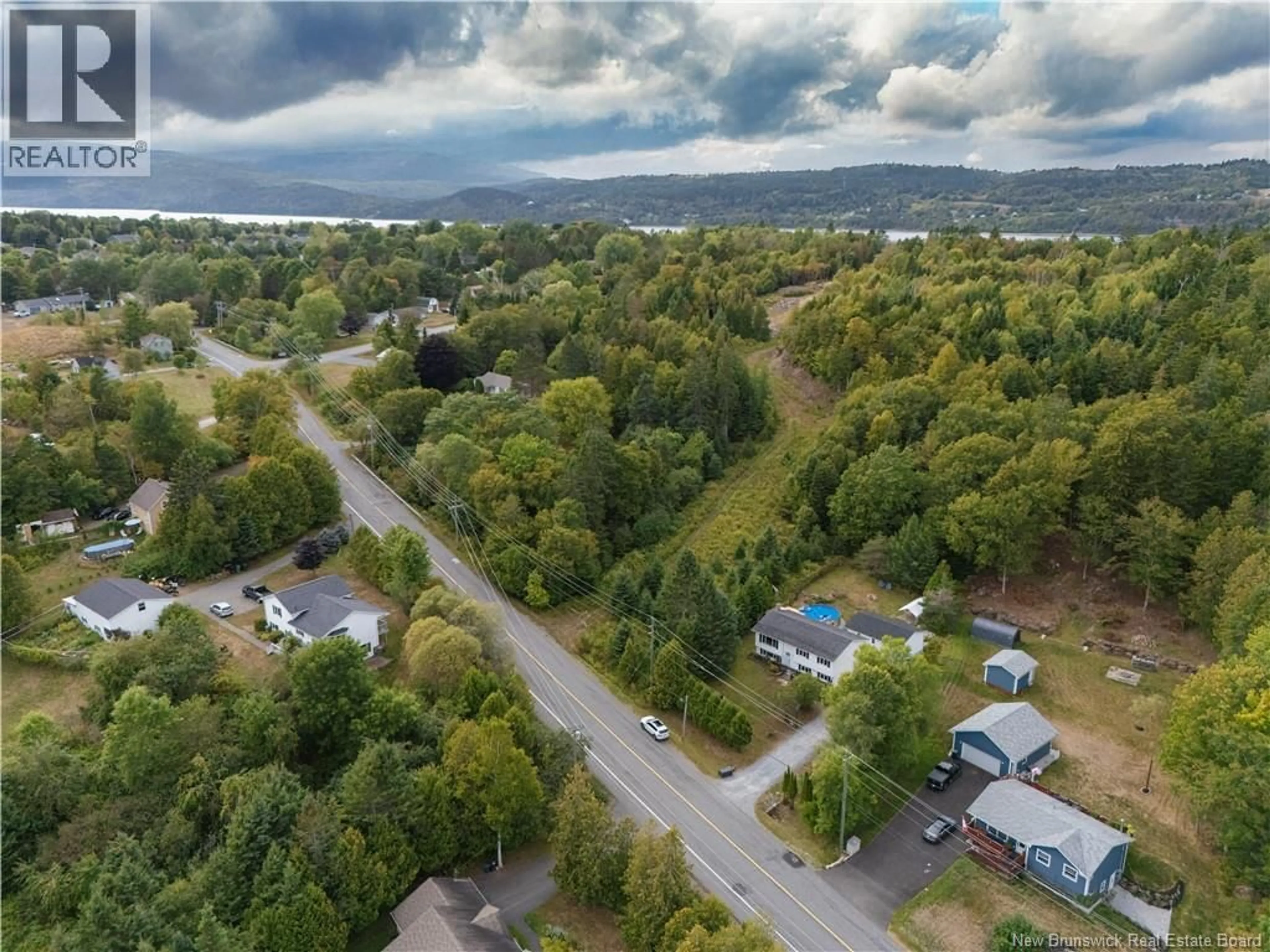 A pic from outside/outdoor area/front of a property/back of a property/a pic from drone, unknown for 13 MEENANS COVE ROAD, Quispamsis New Brunswick E2E1M7