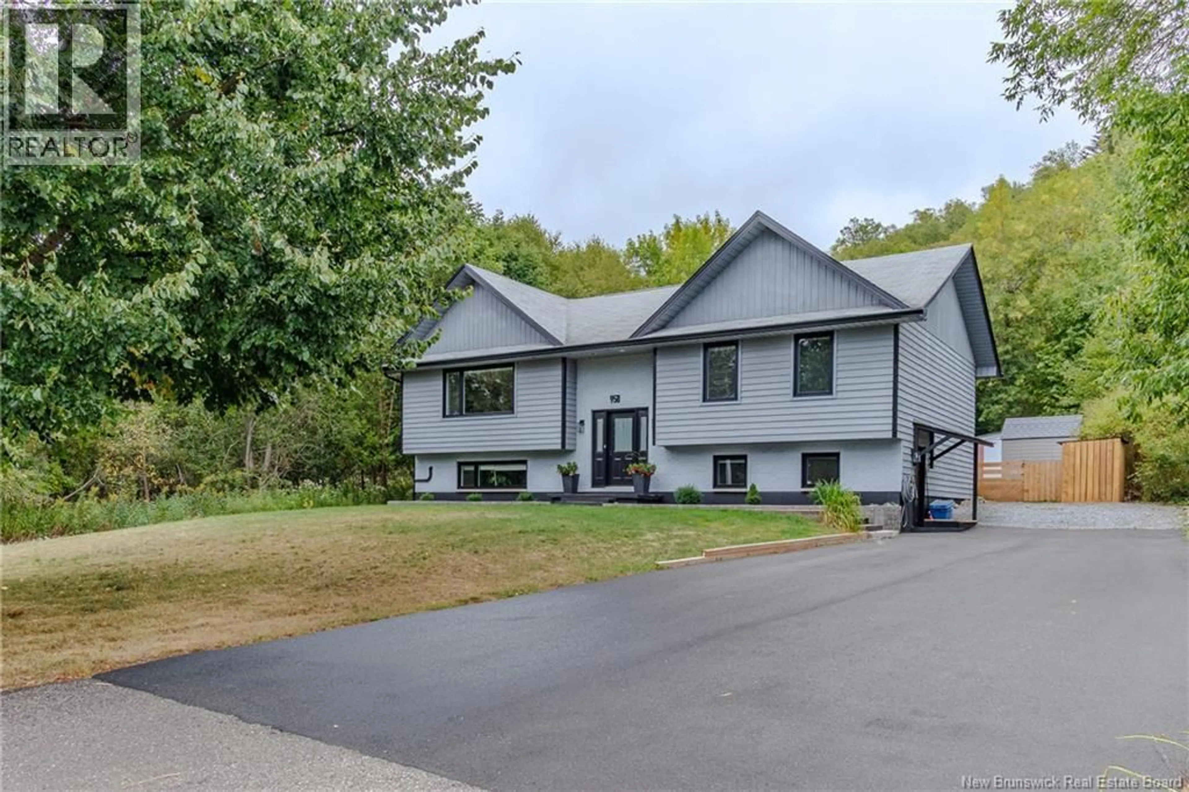 Home with vinyl exterior material, street for 958 KENNEBECASIS DRIVE, Saint John New Brunswick E2K5A8