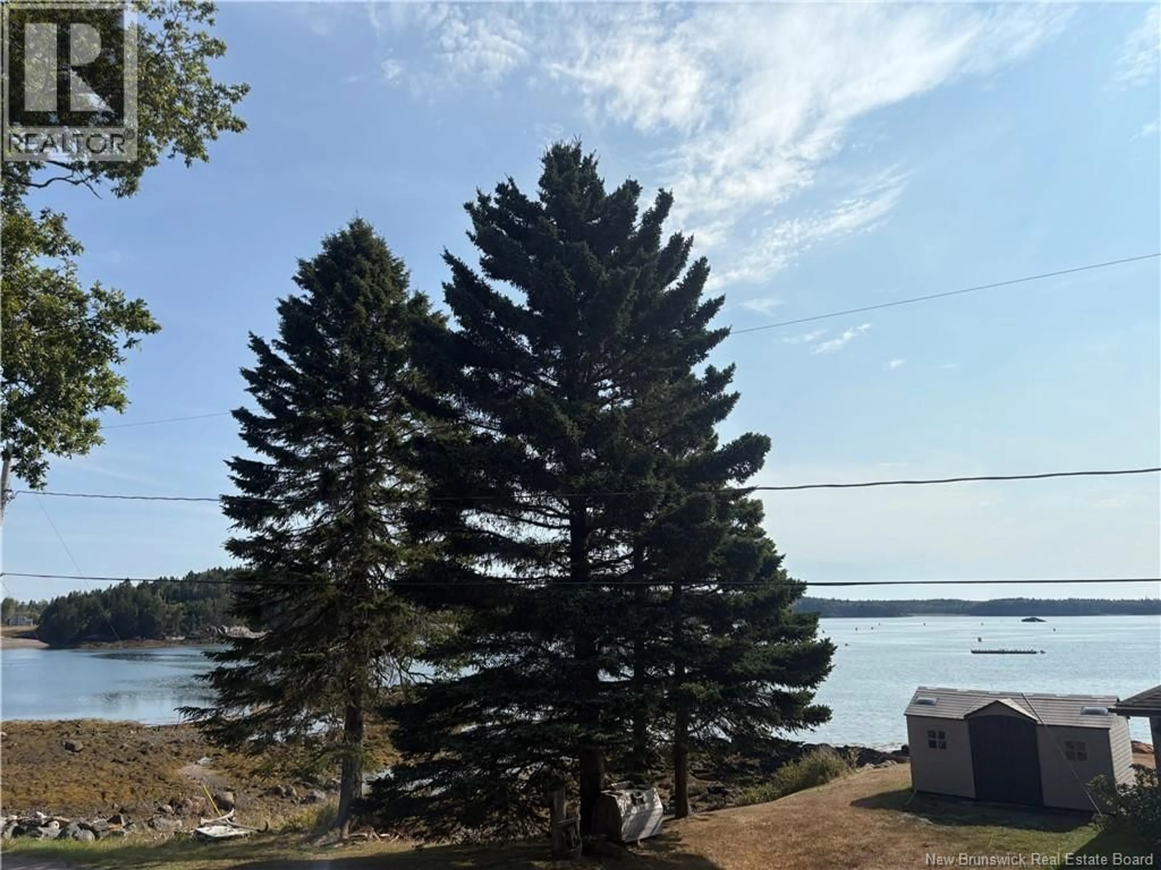 A pic from outside/outdoor area/front of a property/back of a property/a pic from drone, water/lake/river/ocean view for 20 BEACH ROAD, Beaver Harbour New Brunswick E5H1M5