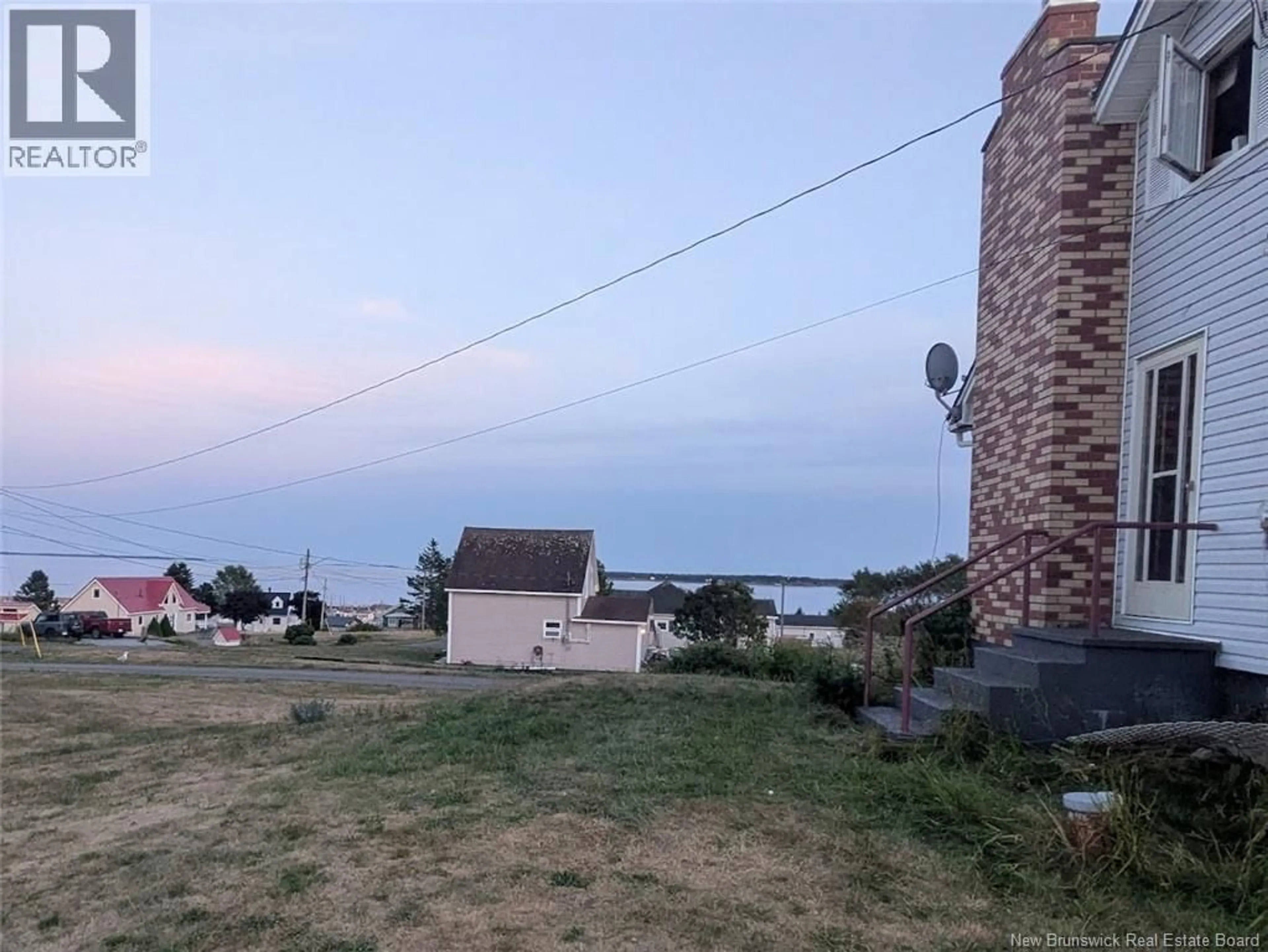 A pic from outside/outdoor area/front of a property/back of a property/a pic from drone, water/lake/river/ocean view for 14 BENSON LANE, Grand Manan New Brunswick E5G1J8