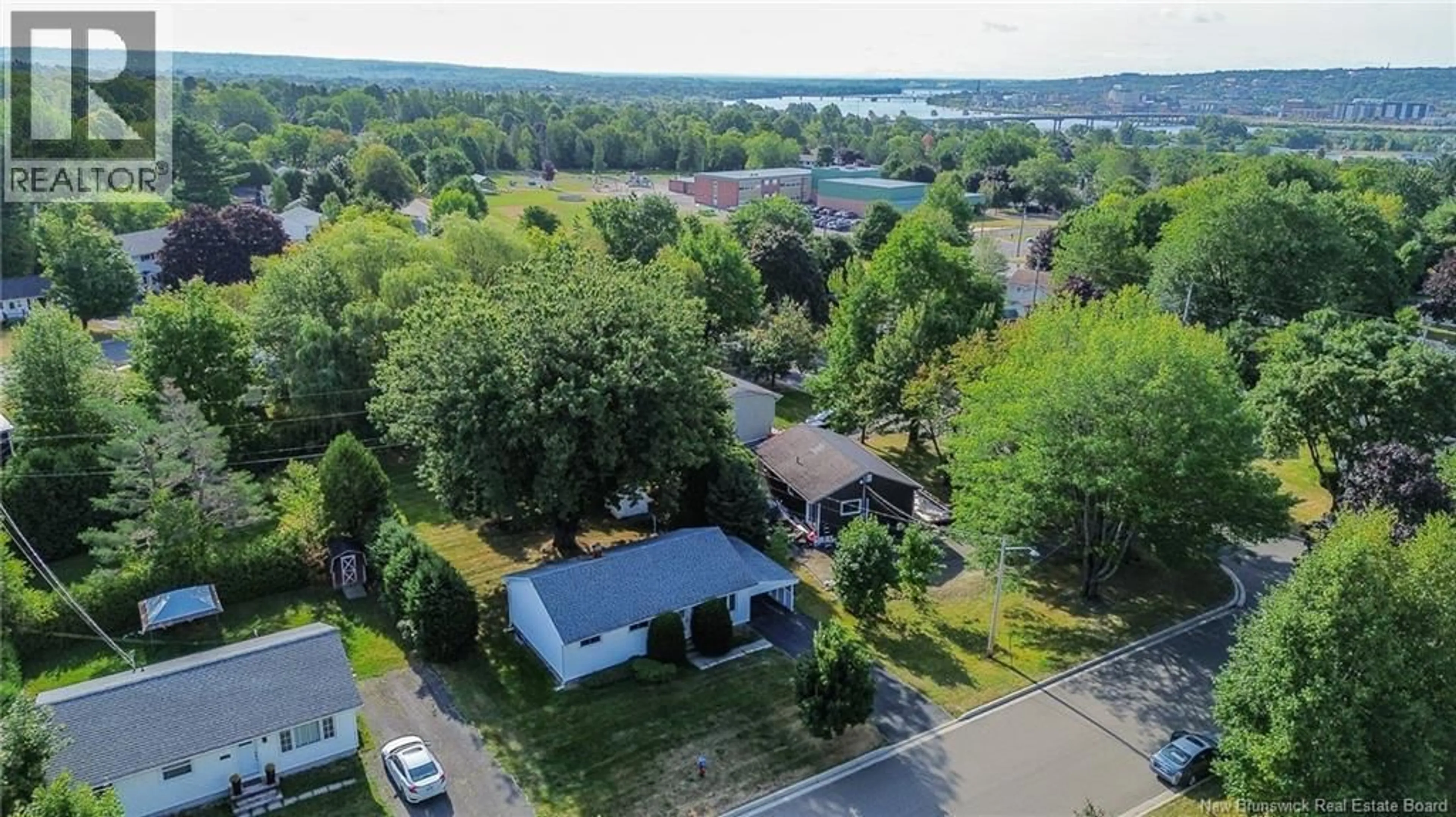 A pic from outside/outdoor area/front of a property/back of a property/a pic from drone, water/lake/river/ocean view for 100 BIRD AVENUE, Fredericton New Brunswick E3A2H7