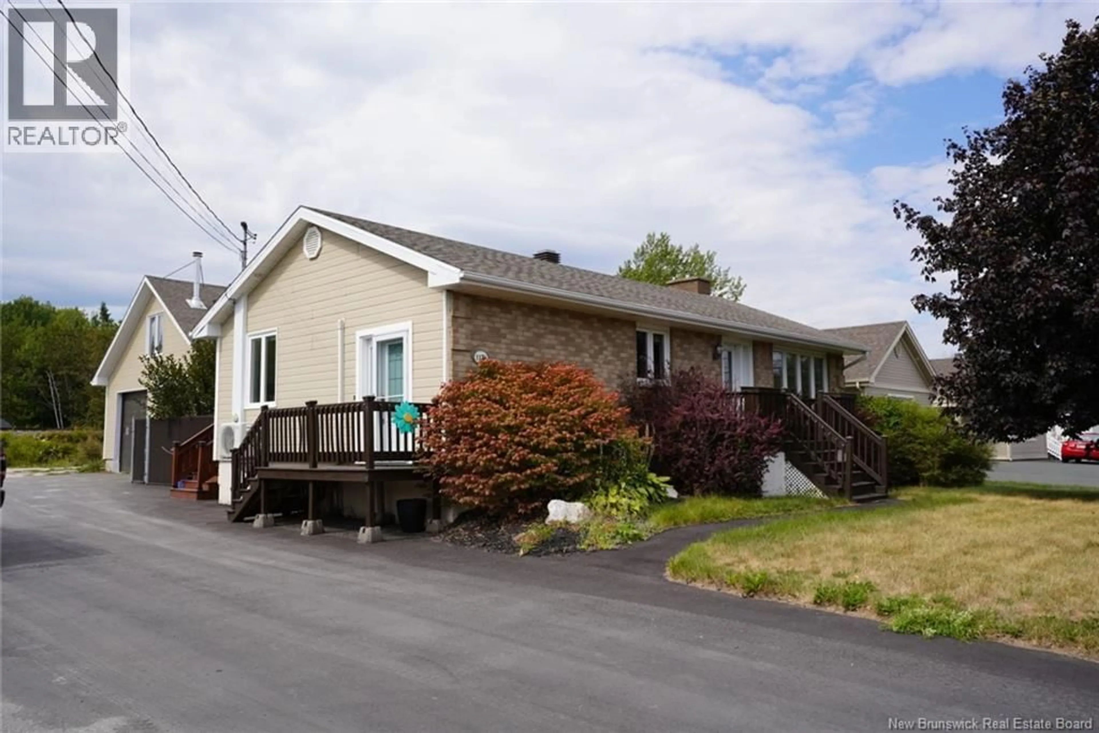 Home with vinyl exterior material, street for 1174 RUE PRINCIPALE, Beresford New Brunswick E8K2J1