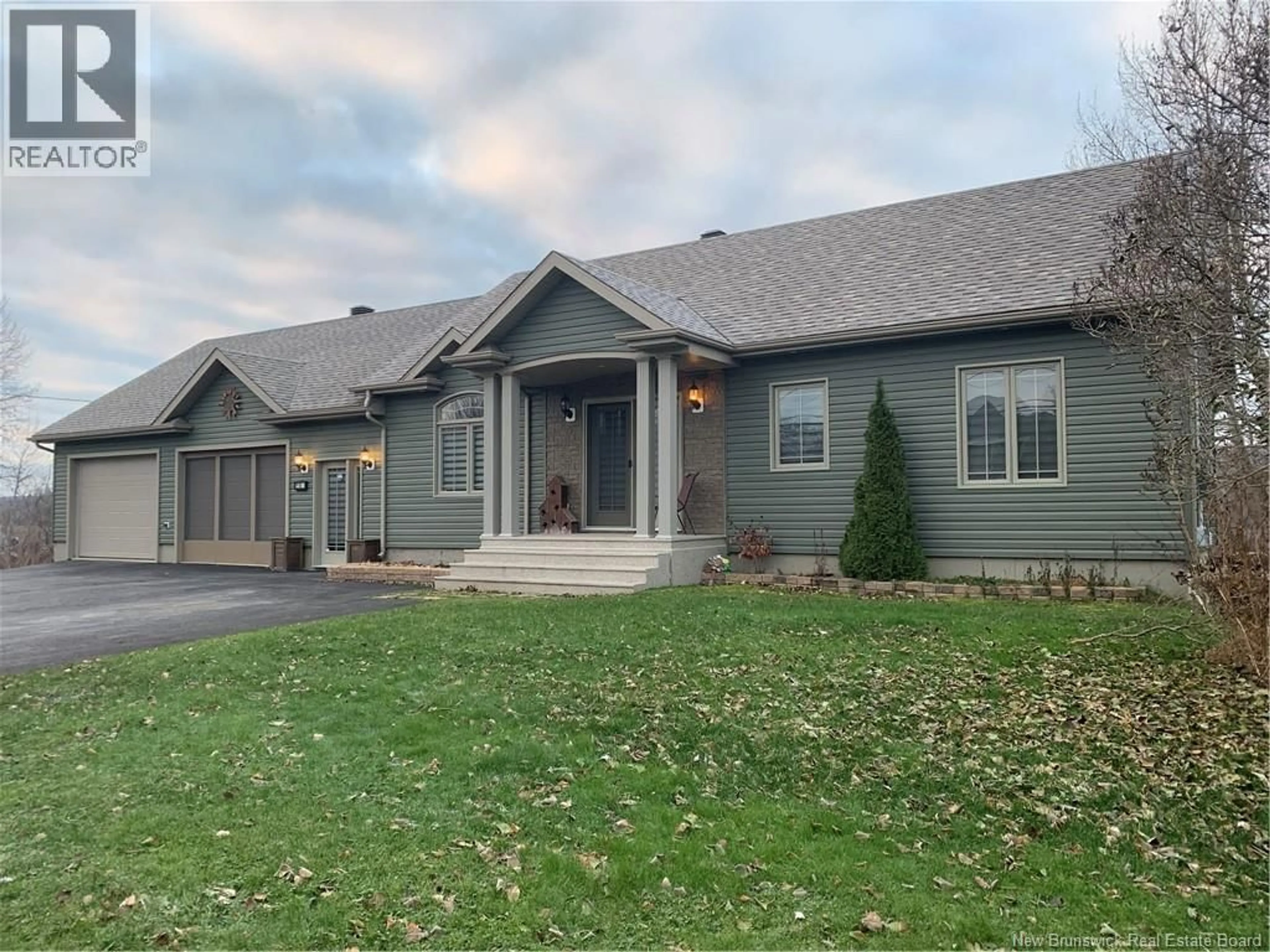 Home with vinyl exterior material, street for 18 RUE PRINCIPALE, Sainte-Anne-De-Madawaska New Brunswick E7E1B5