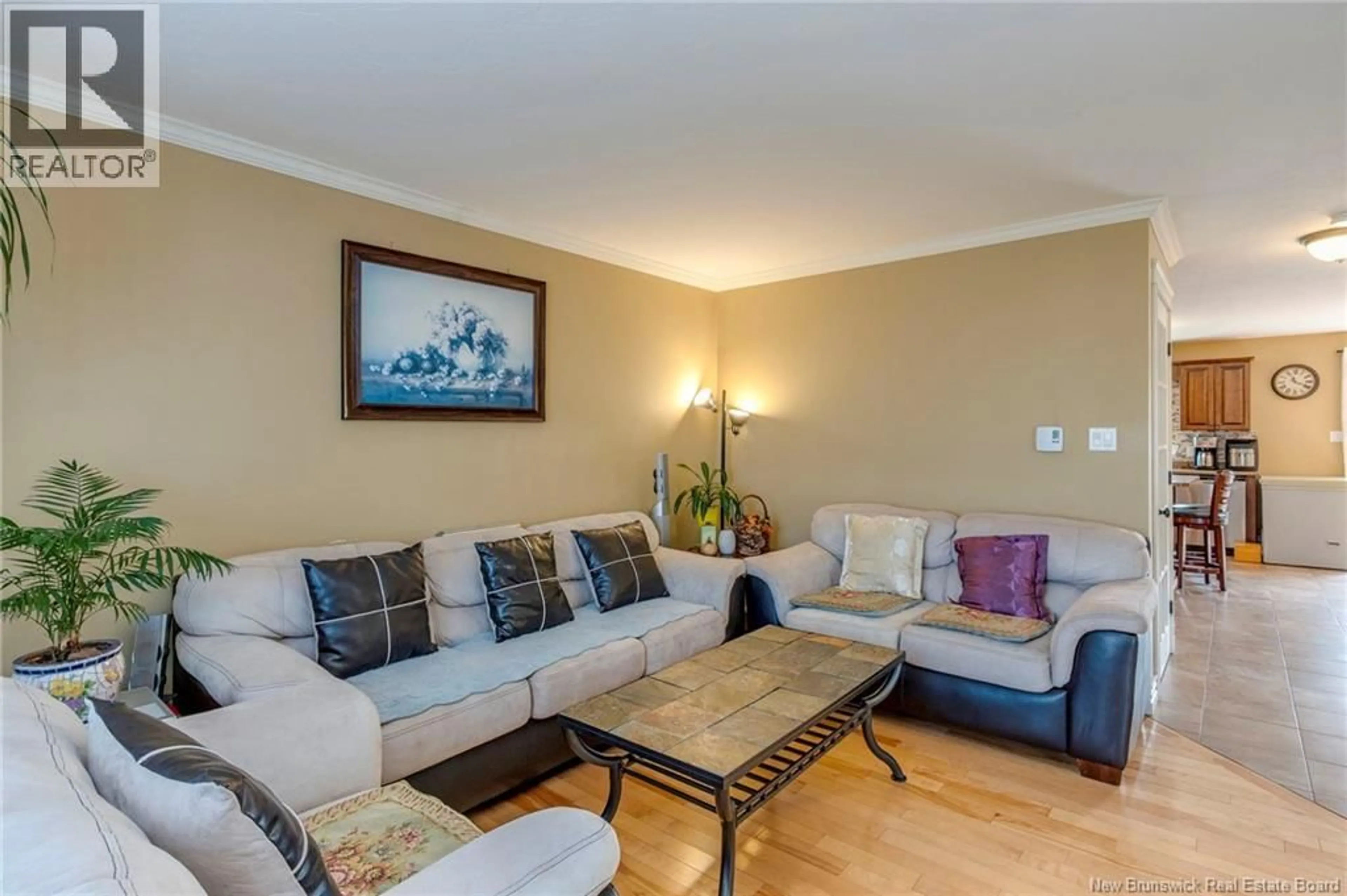 Living room with furniture, wood/laminate floor for 108 RAINFORD COURT, Moncton New Brunswick E1G0T4