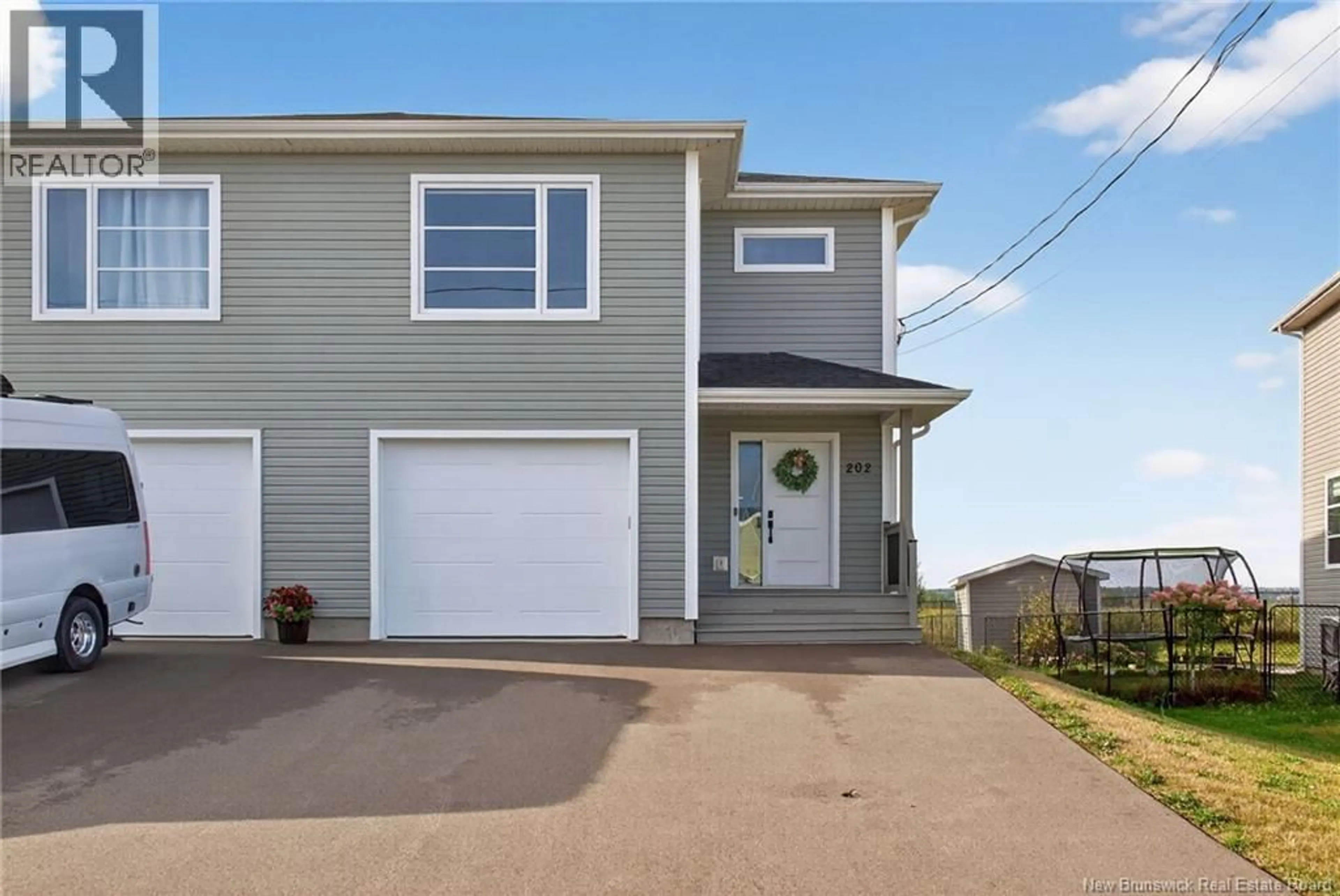 Home with vinyl exterior material, street for 202 SURETTE, Dieppe New Brunswick E1A9R4