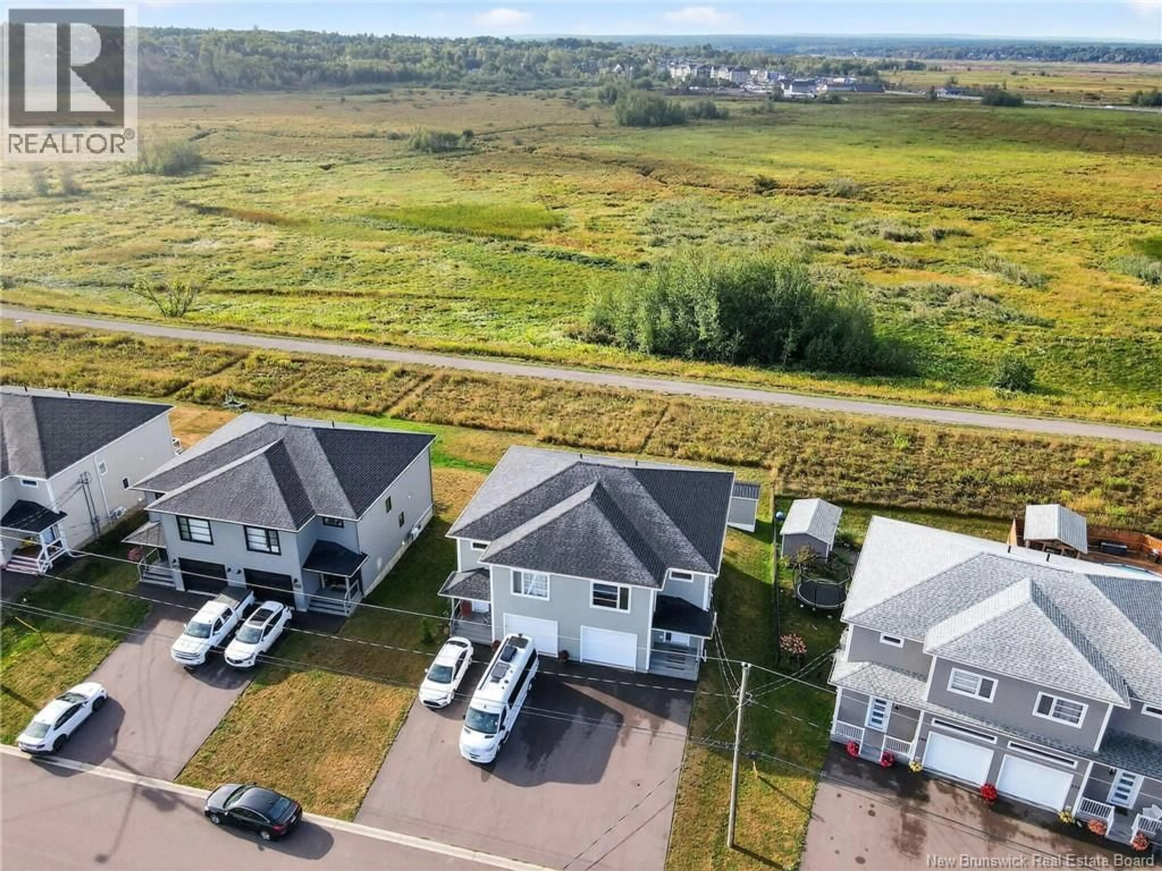 A pic from outside/outdoor area/front of a property/back of a property/a pic from drone, water/lake/river/ocean view for 202 SURETTE, Dieppe New Brunswick E1A9R4