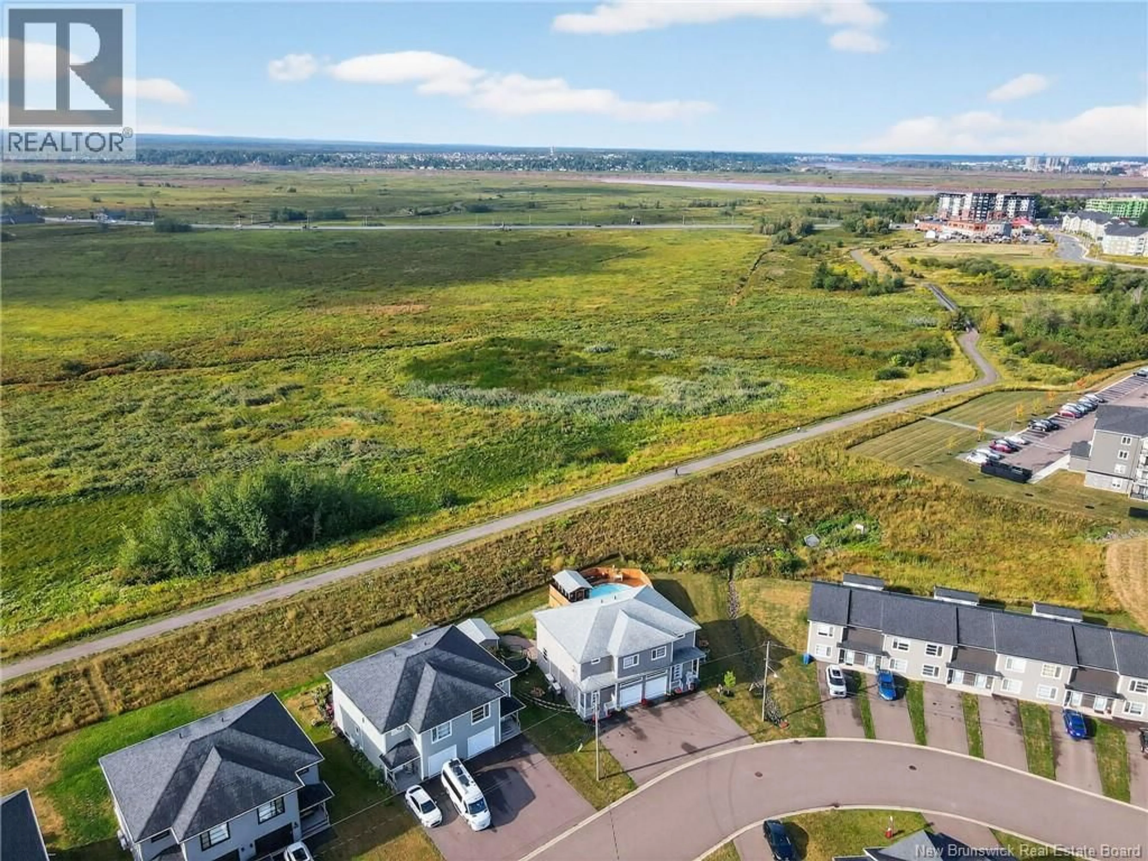 A pic from outside/outdoor area/front of a property/back of a property/a pic from drone, water/lake/river/ocean view for 202 SURETTE, Dieppe New Brunswick E1A9R4