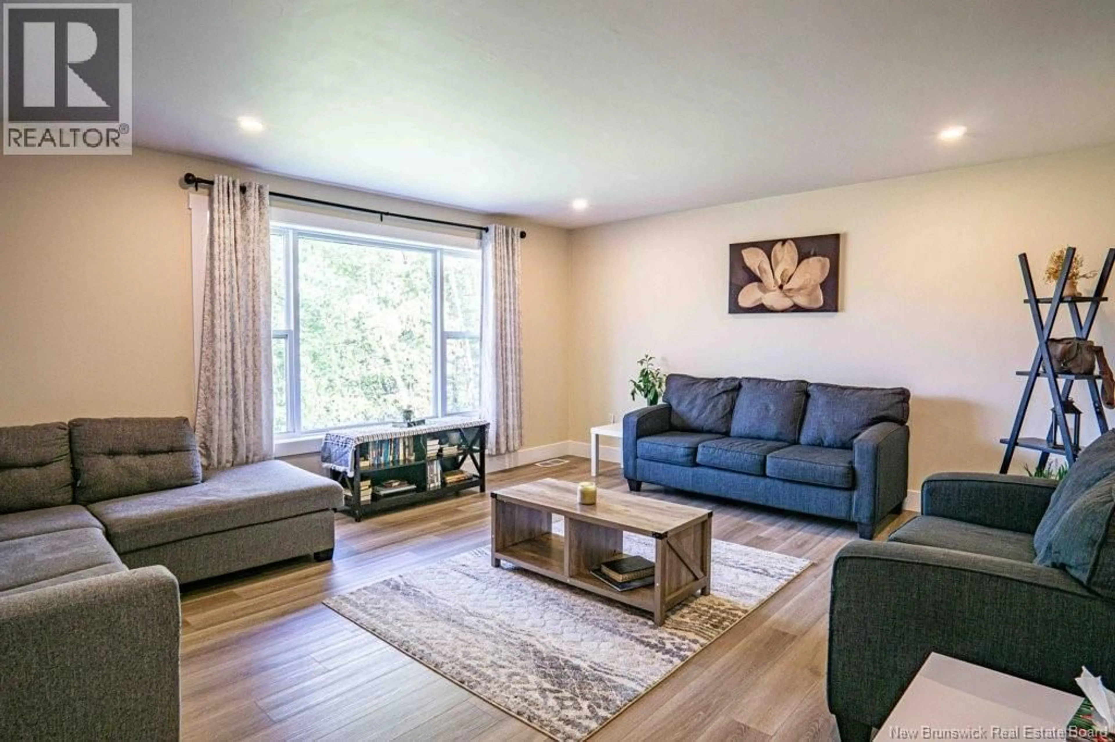 Living room with furniture, wood/laminate floor for 1869 RTE 620, Royal Road New Brunswick E3G6N5