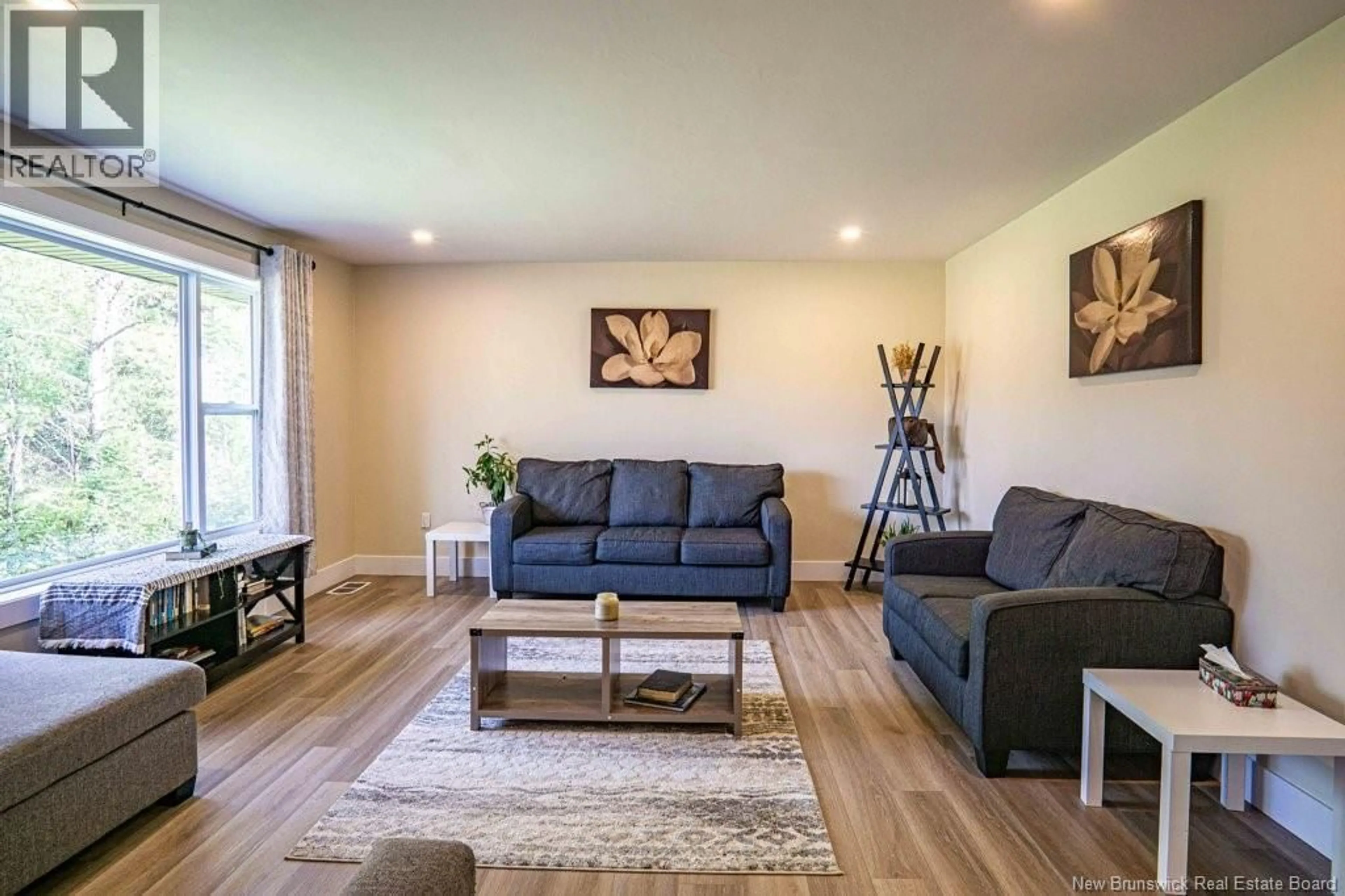 Living room with furniture, wood/laminate floor for 1869 RTE 620, Royal Road New Brunswick E3G6N5