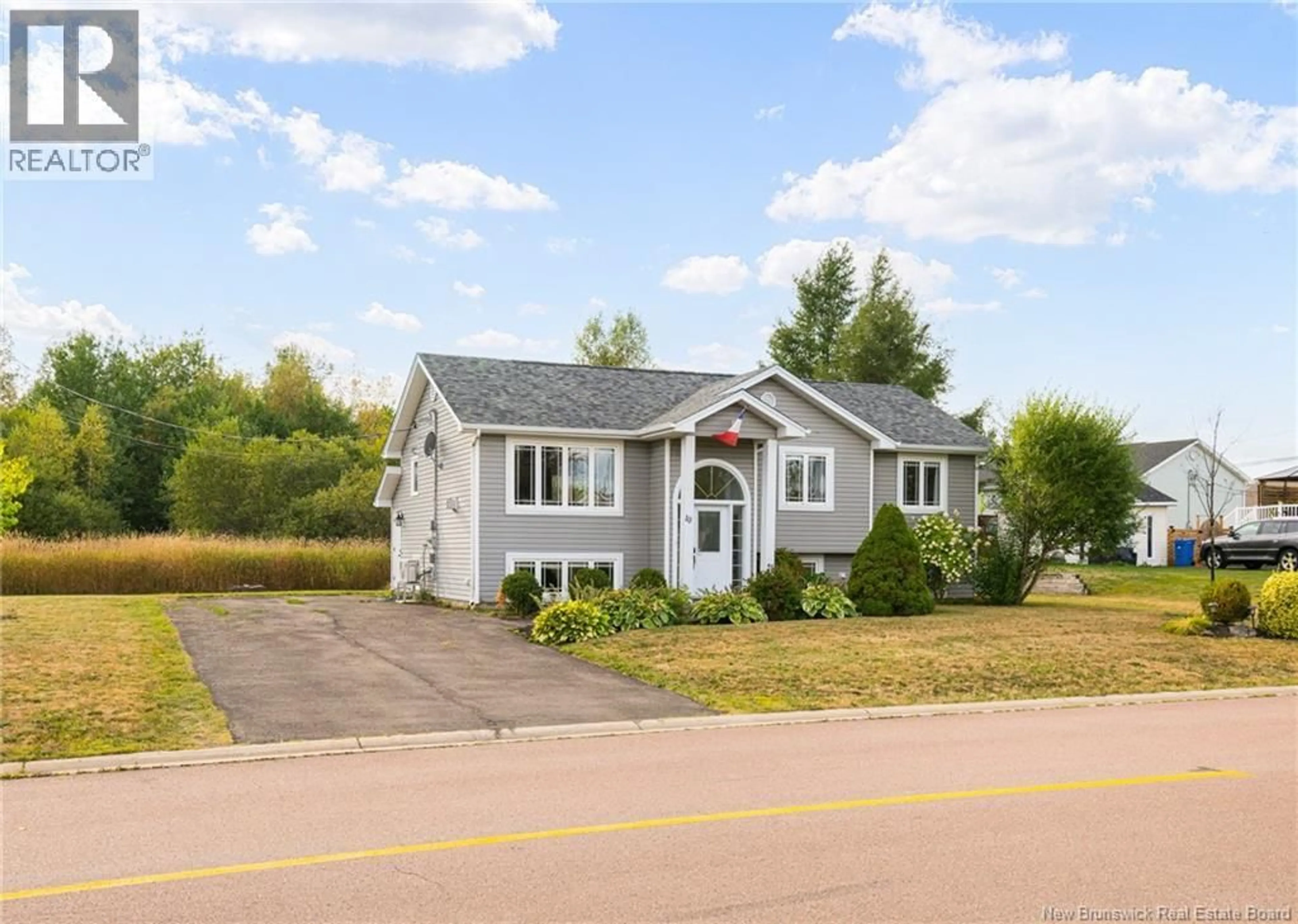 Home with vinyl exterior material, street for 10 ADOLPHE, Dieppe New Brunswick E1A8R8