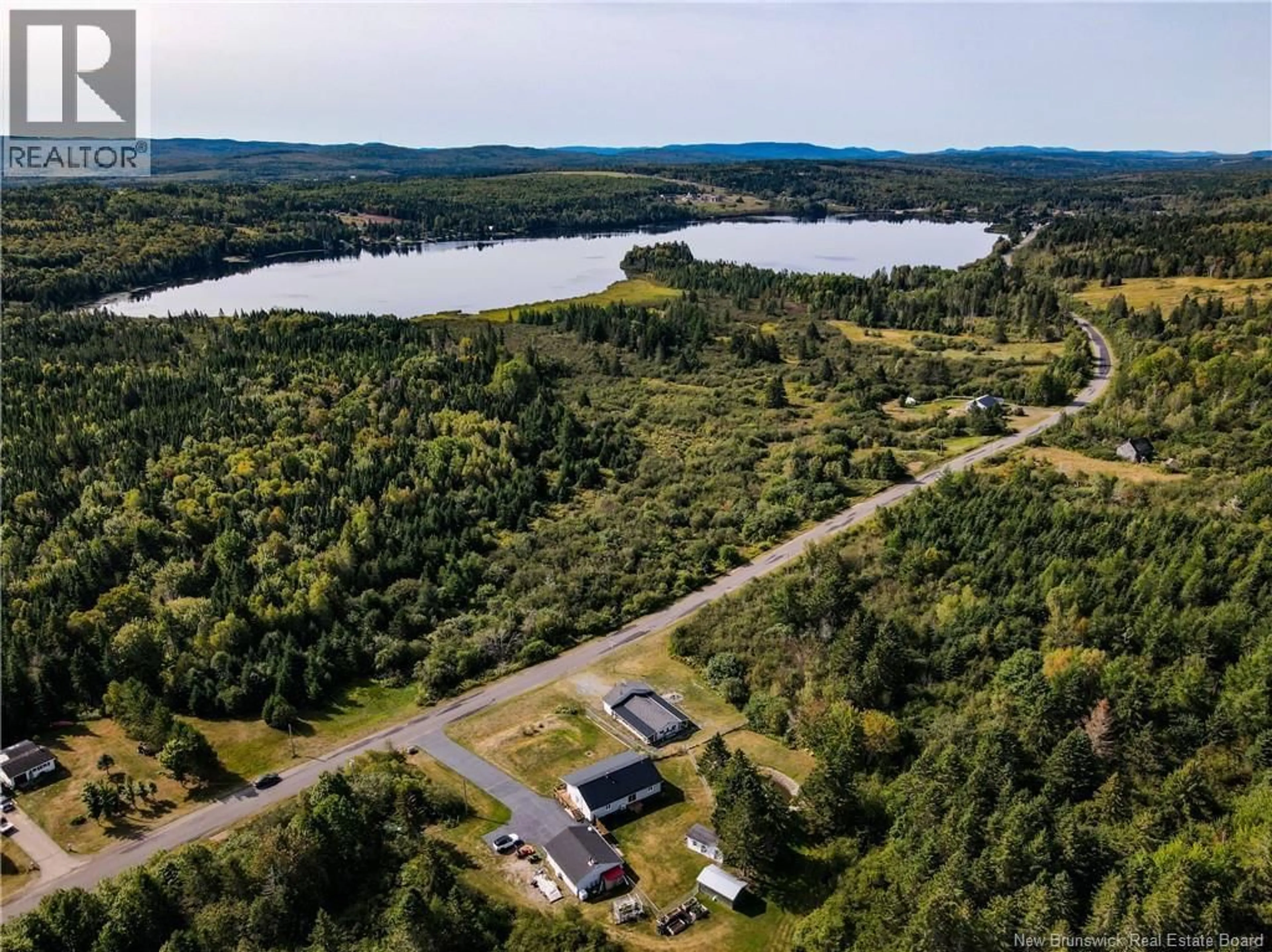 A pic from outside/outdoor area/front of a property/back of a property/a pic from drone, water/lake/river/ocean view for 211 LAKEFIELD ROAD, Cassidy Lake New Brunswick E4E3M8