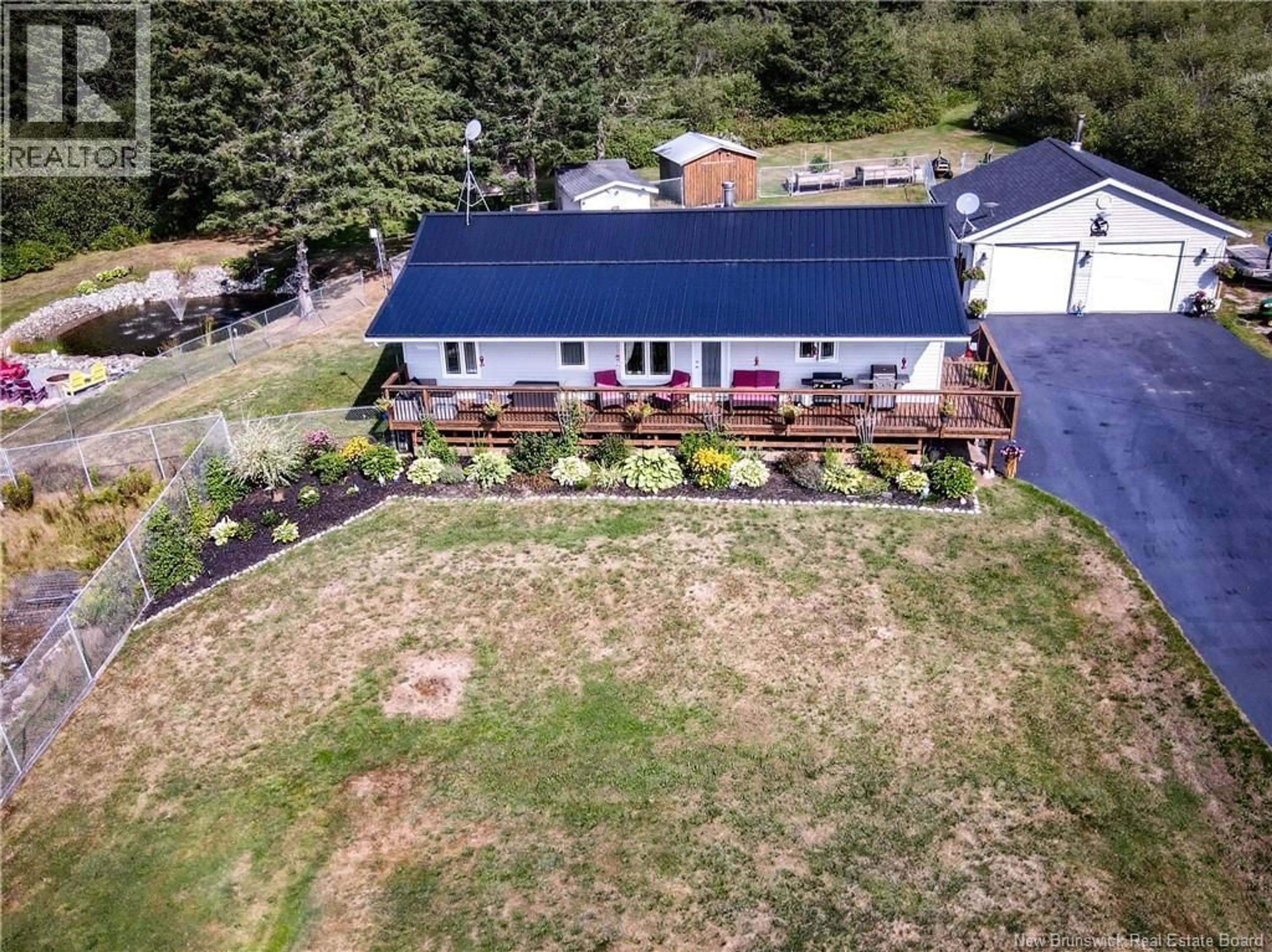 A pic from outside/outdoor area/front of a property/back of a property/a pic from drone, unknown for 211 LAKEFIELD ROAD, Cassidy Lake New Brunswick E4E3M8