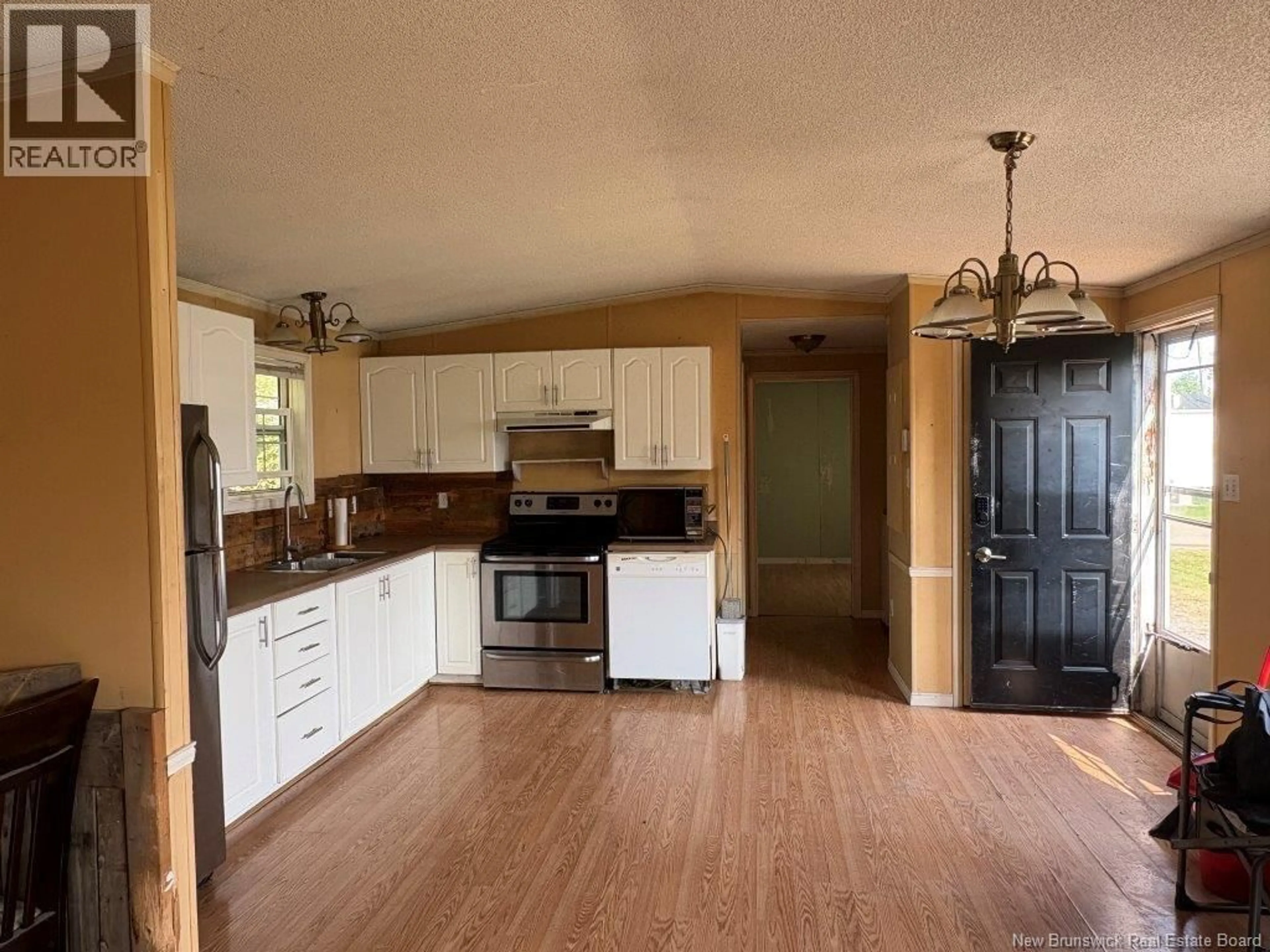 Open concept kitchen, wood/laminate floor for 31 PETERSON AVENUE, New Maryland New Brunswick E3C1P4