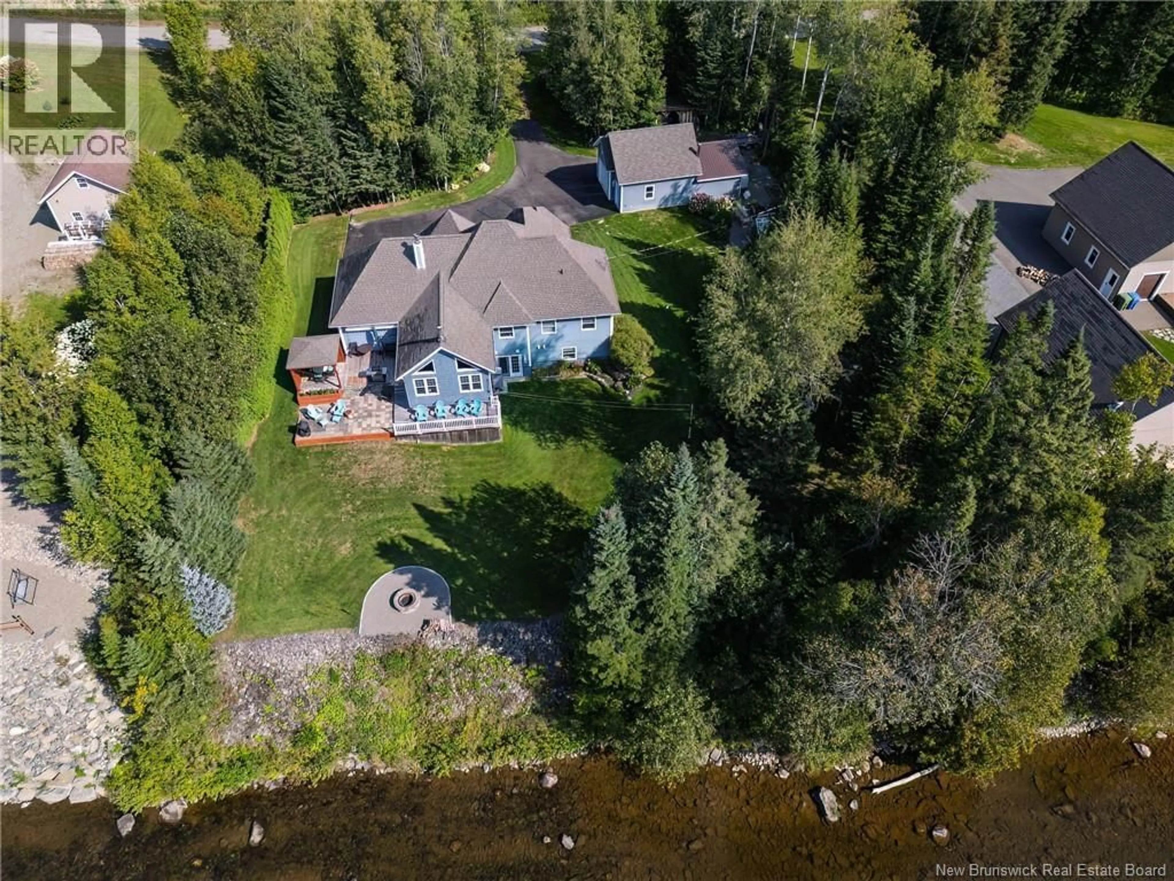 A pic from outside/outdoor area/front of a property/back of a property/a pic from drone, water/lake/river/ocean view for 63 RIVERSIDE CRESCENT, DSL de Drummond/DSL of Drummond New Brunswick E3Y3Y2