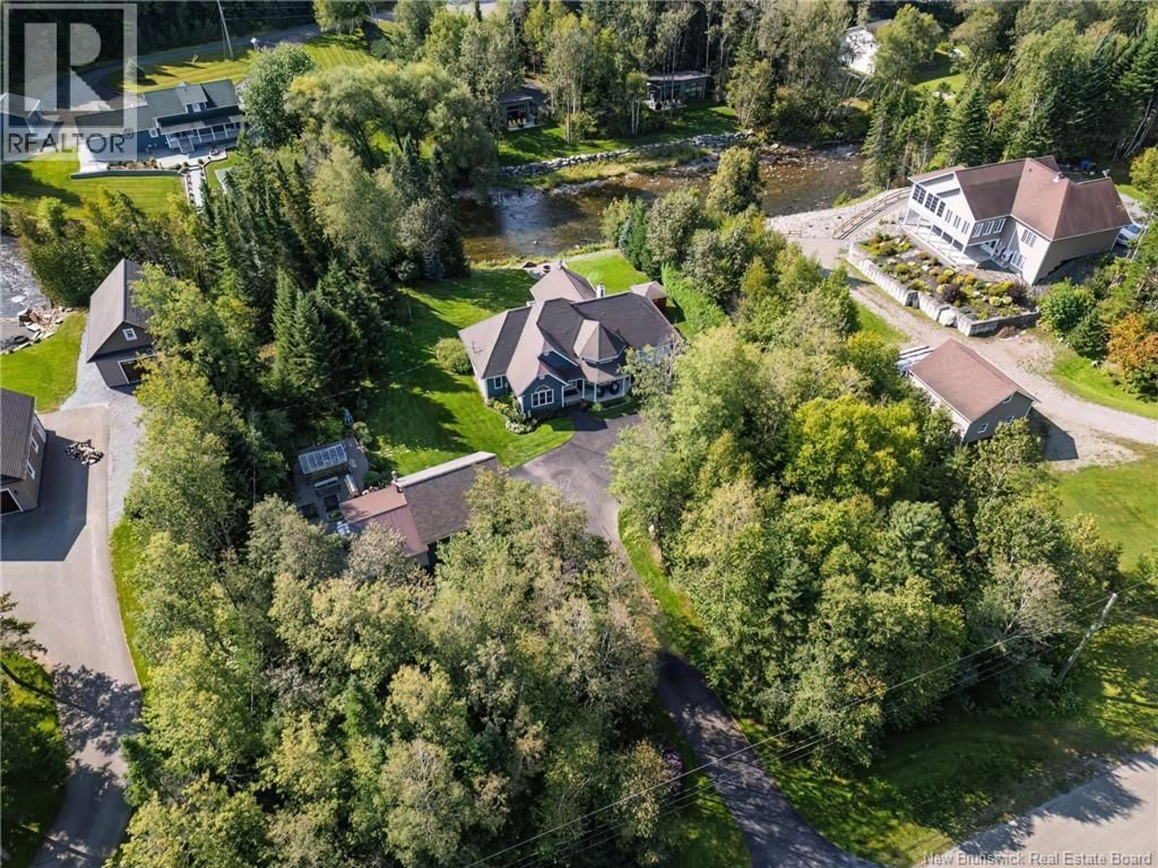 A pic from outside/outdoor area/front of a property/back of a property/a pic from drone, unknown for 63 RIVERSIDE CRESCENT, DSL de Drummond/DSL of Drummond New Brunswick E3Y3Y2