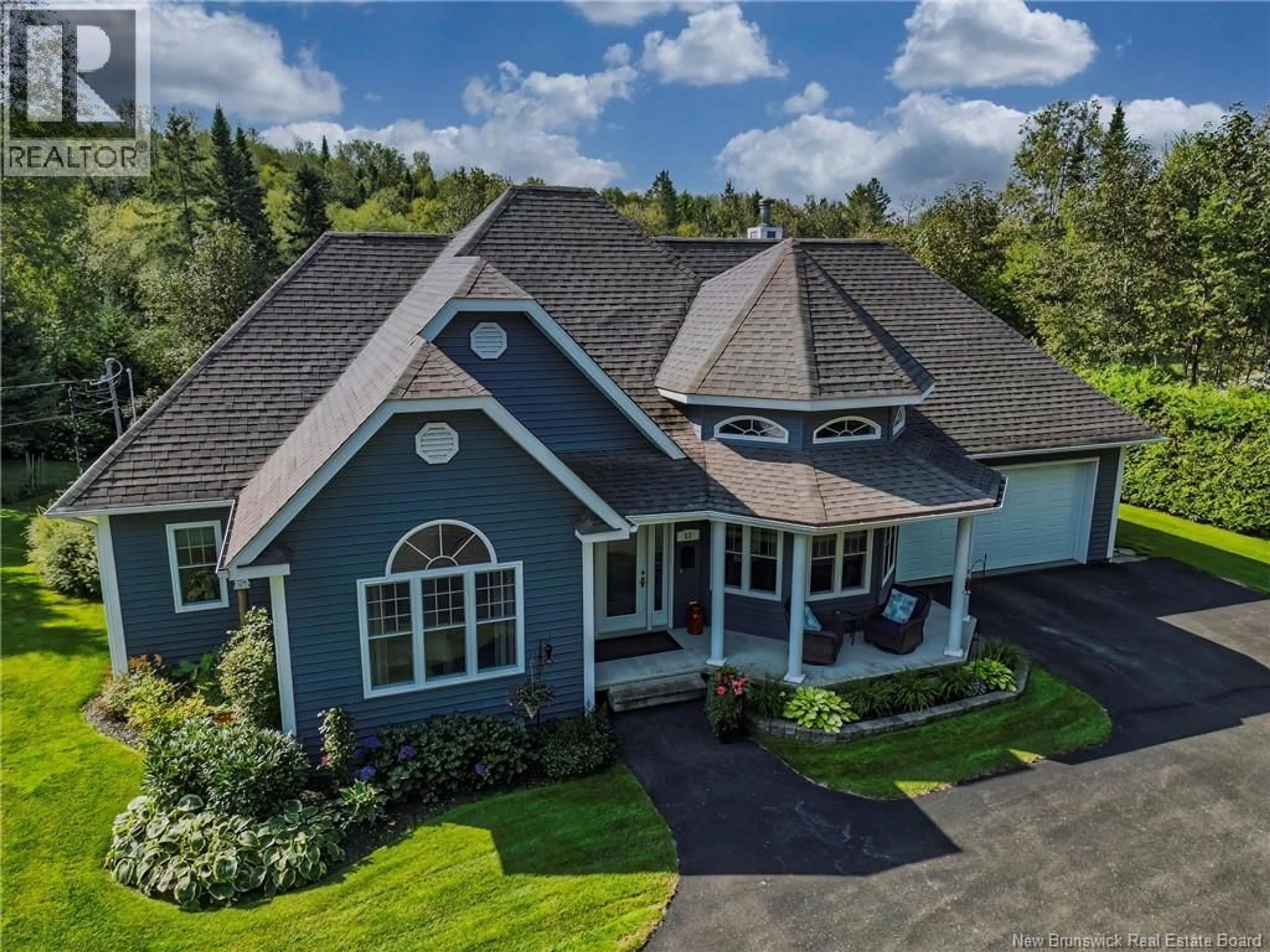 A pic from outside/outdoor area/front of a property/back of a property/a pic from drone, mountain view for 63 RIVERSIDE CRESCENT, DSL de Drummond/DSL of Drummond New Brunswick E3Y3Y2
