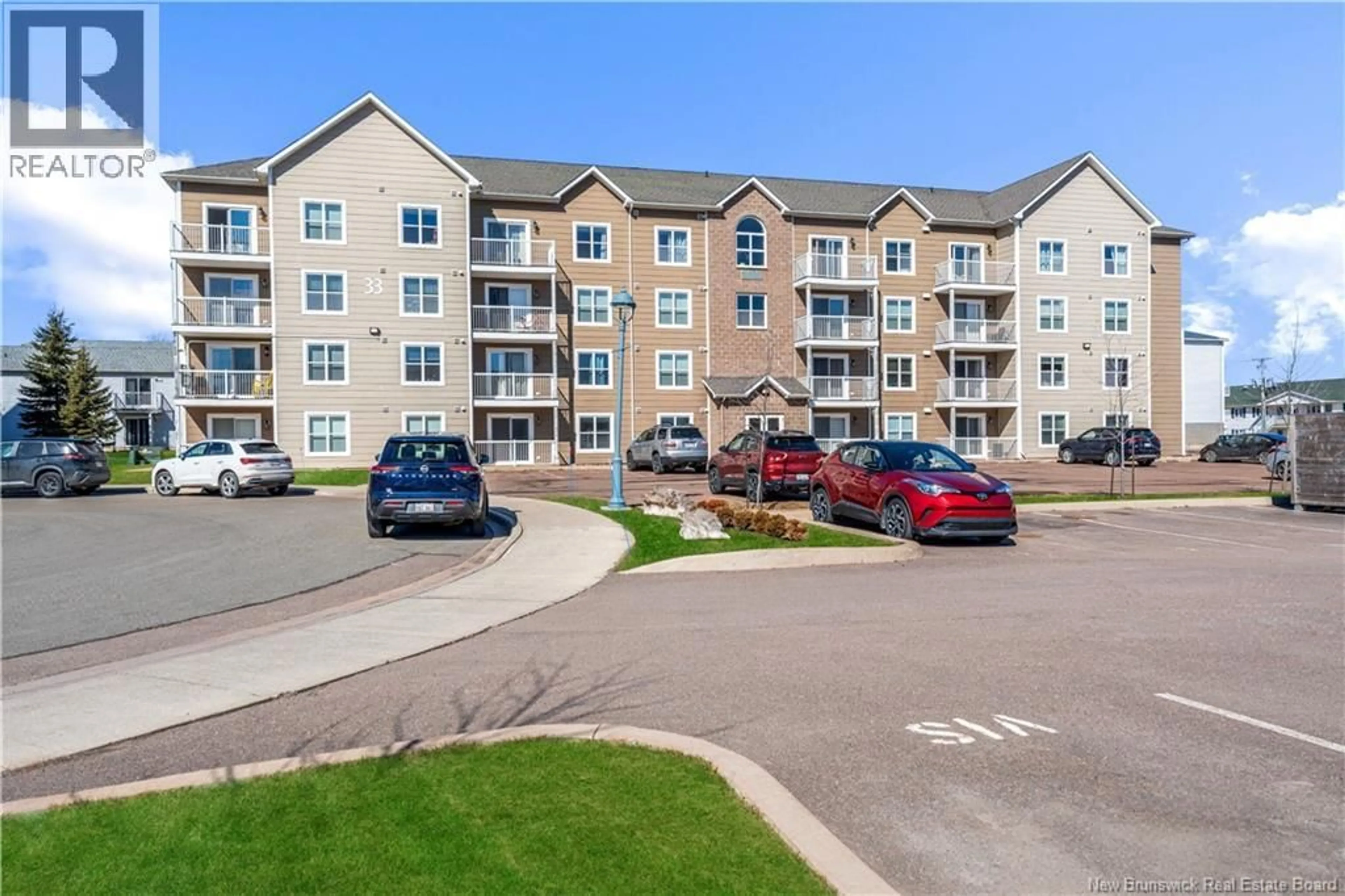 A pic from outside/outdoor area/front of a property/back of a property/a pic from drone, unknown for 106 - 33 SIFROI STREET, Dieppe New Brunswick E1A5T1