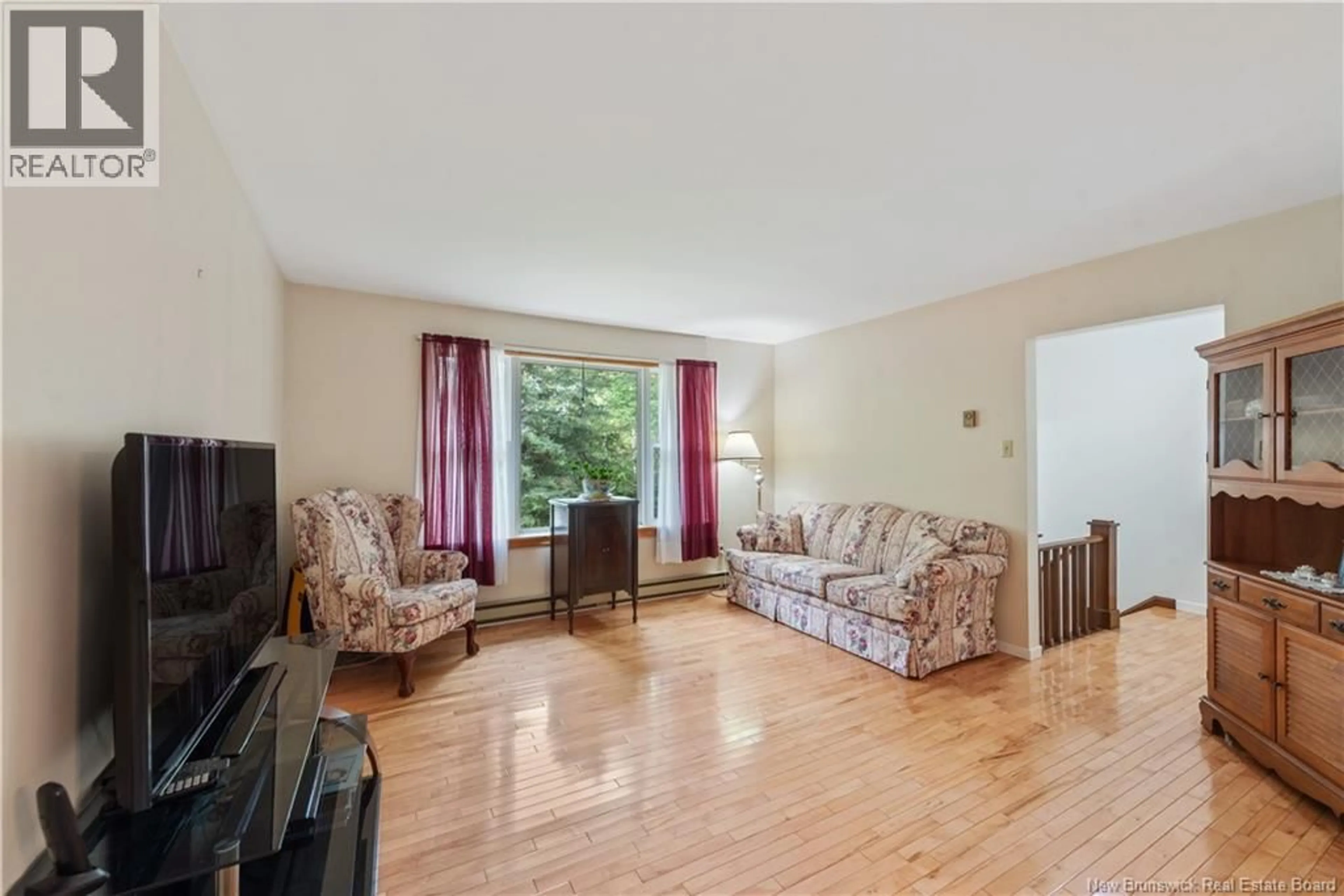 Living room with furniture, wood/laminate floor for 16 MALIBOU STREET, Lower Coverdale New Brunswick E1J1K4