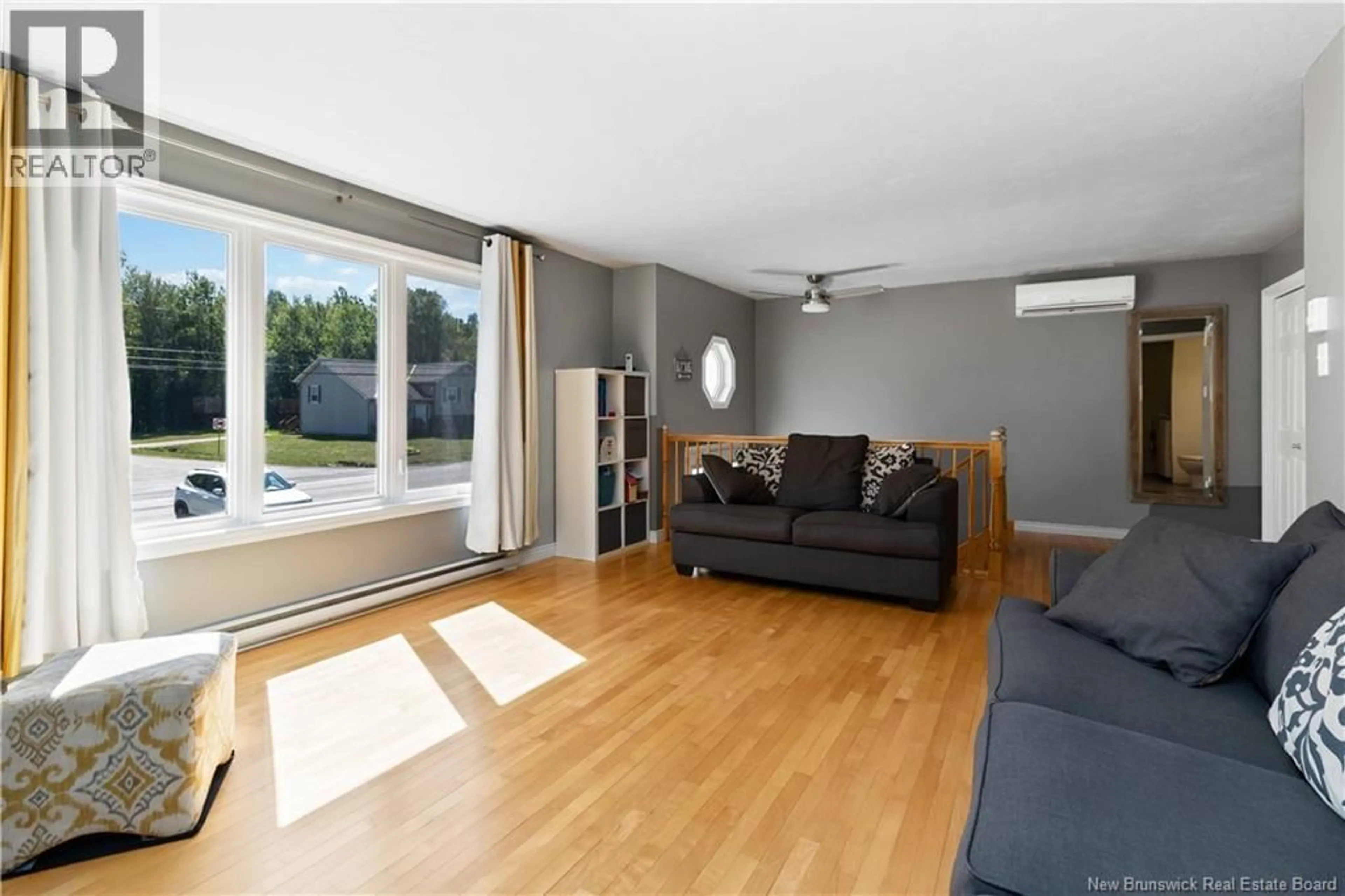 Living room with furniture, wood/laminate floor for 257 CHARLES LUTES ROAD, Moncton New Brunswick E1G2R8