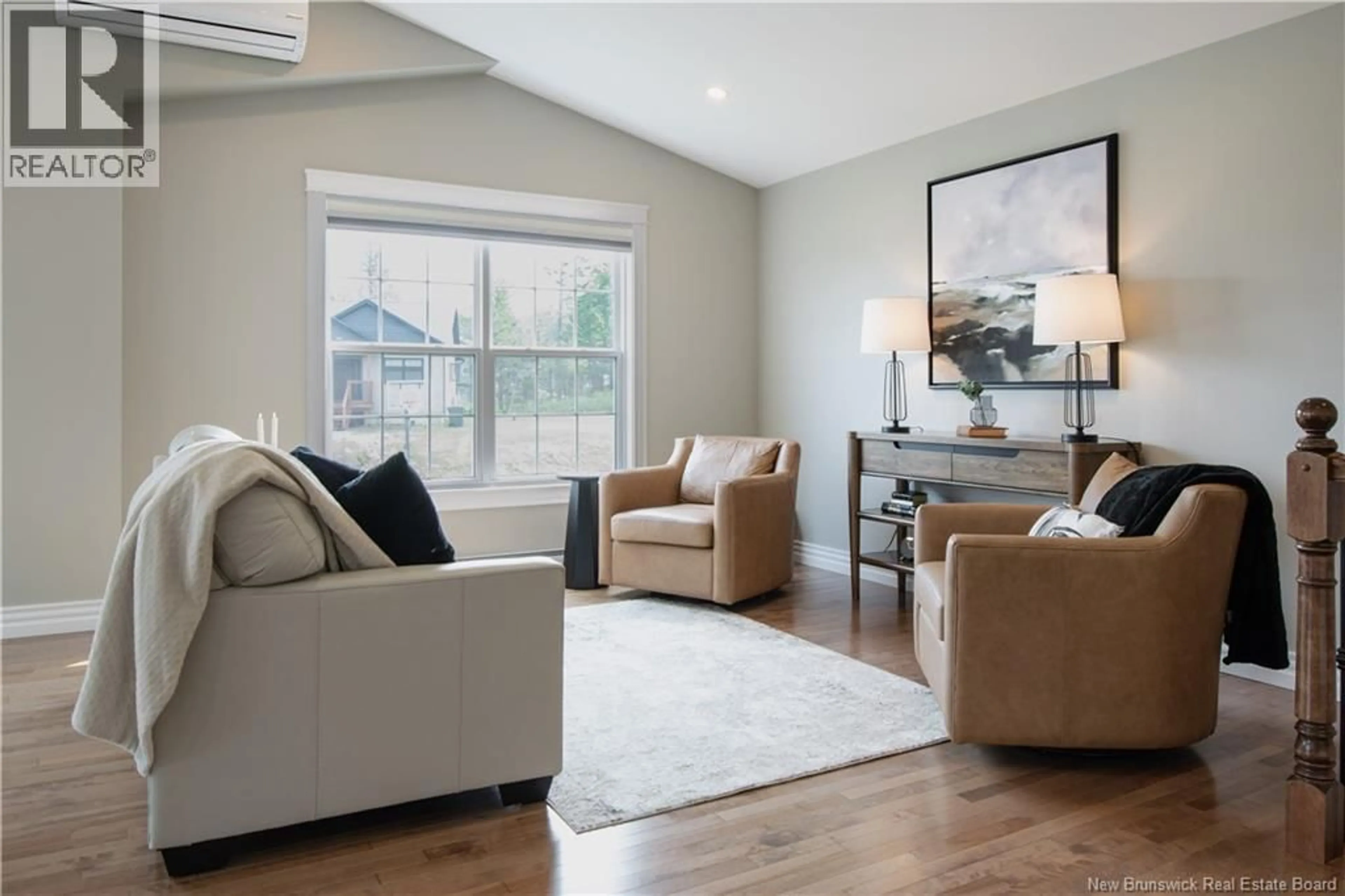 Living room with furniture, wood/laminate floor for 19 PERRY COURT, Quispamsis New Brunswick E2G0K7
