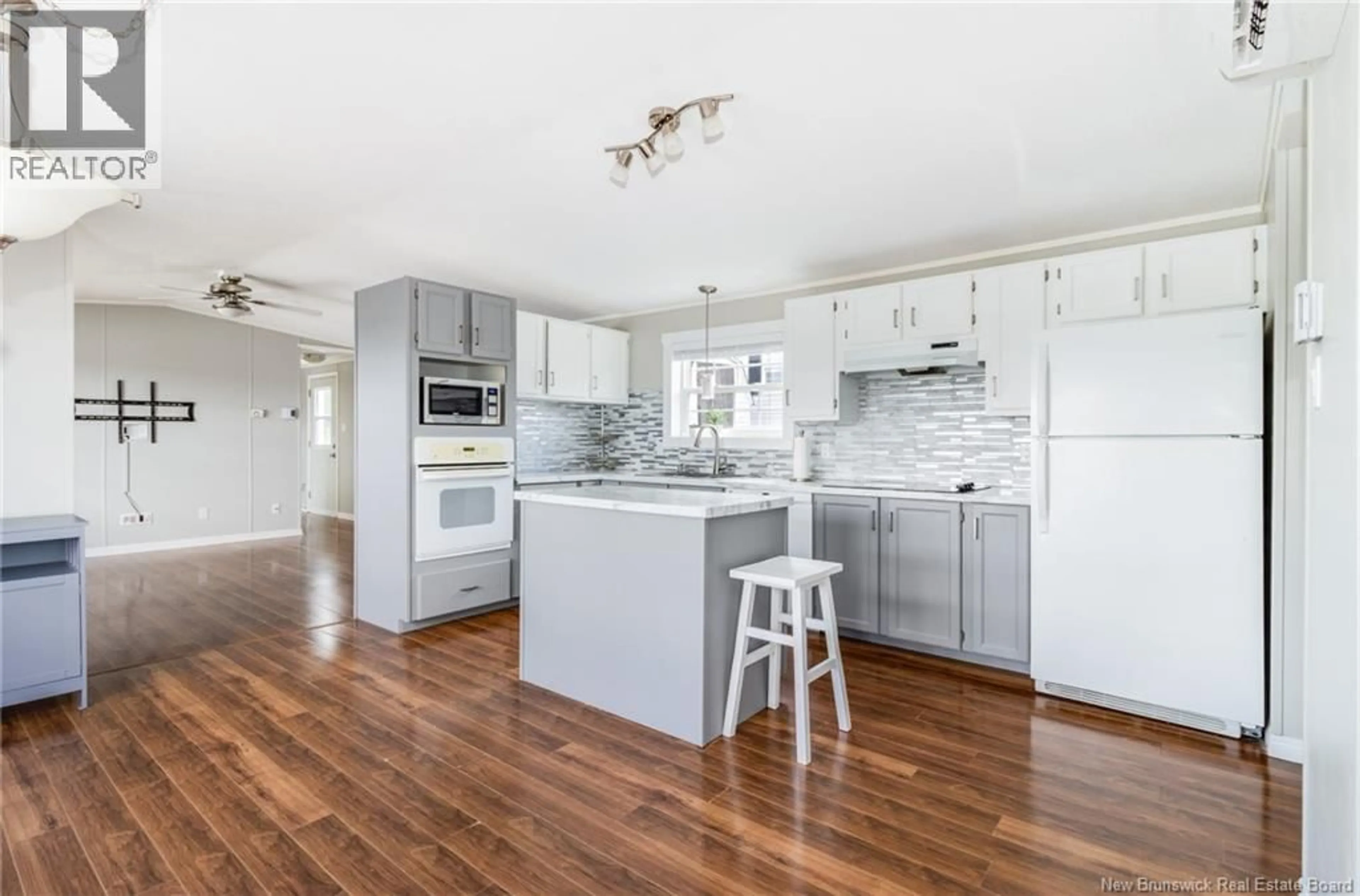 Open concept kitchen, wood/laminate floor for 24 BARRINGTON ROAD, Fredericton New Brunswick E3C1L8