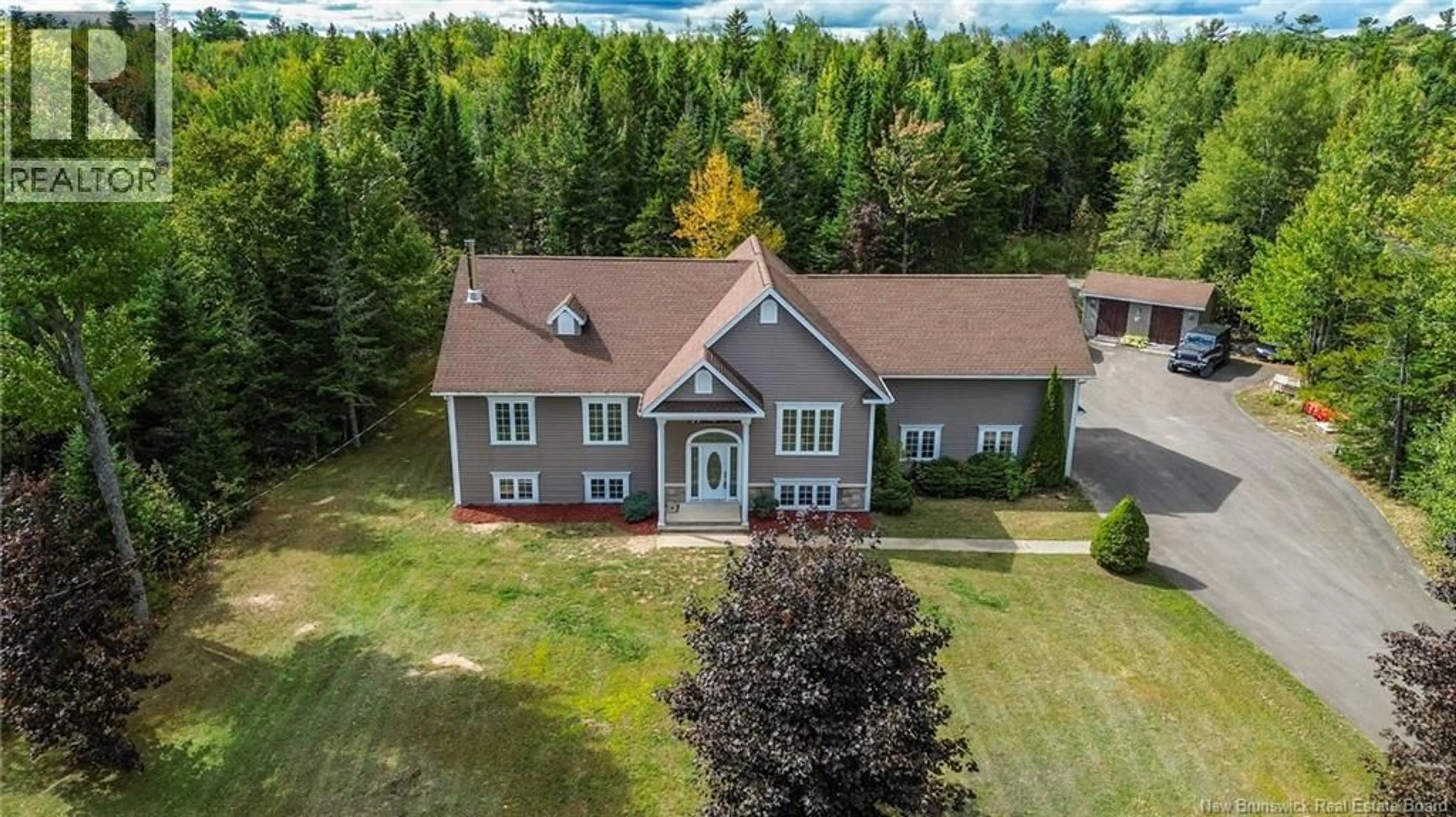 A pic from outside/outdoor area/front of a property/back of a property/a pic from drone, unknown for 37 TAYLOR DRIVE, Hanwell New Brunswick E3C1N9