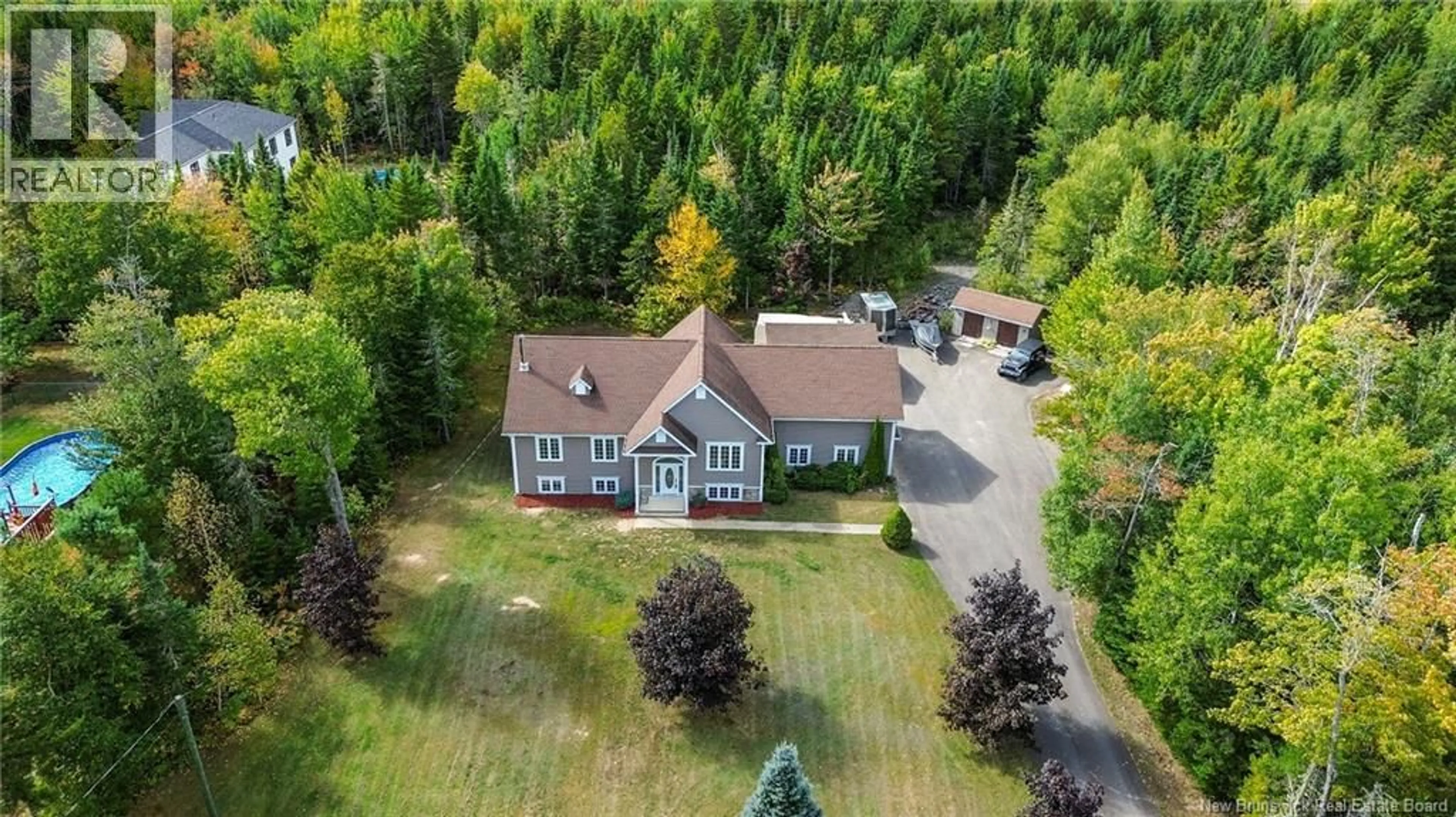 A pic from outside/outdoor area/front of a property/back of a property/a pic from drone, unknown for 37 TAYLOR DRIVE, Hanwell New Brunswick E3C1N9