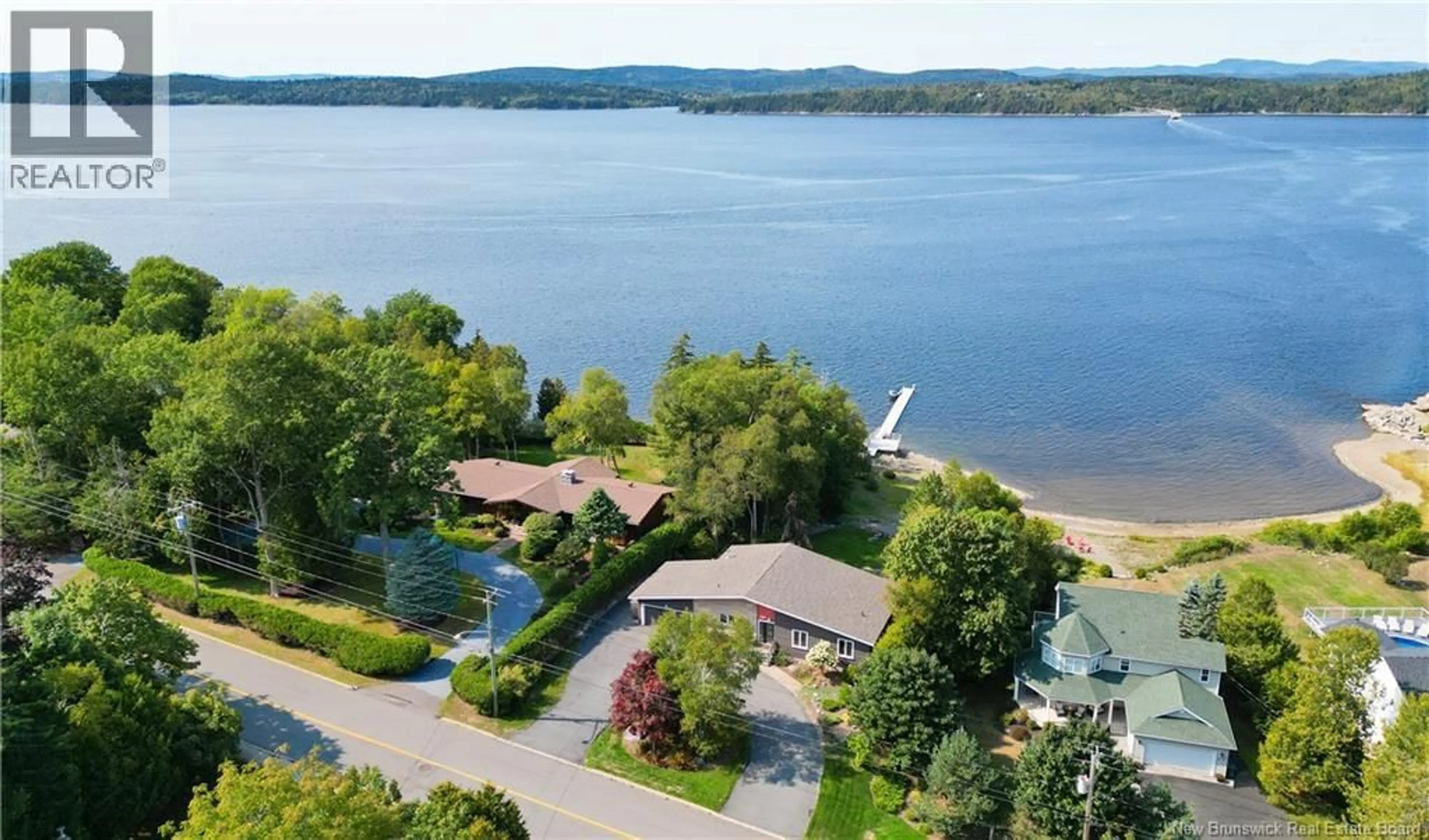 A pic from outside/outdoor area/front of a property/back of a property/a pic from drone, water/lake/river/ocean view for 1005 KENNEBECASIS DRIVE, Saint John New Brunswick E2K5A6