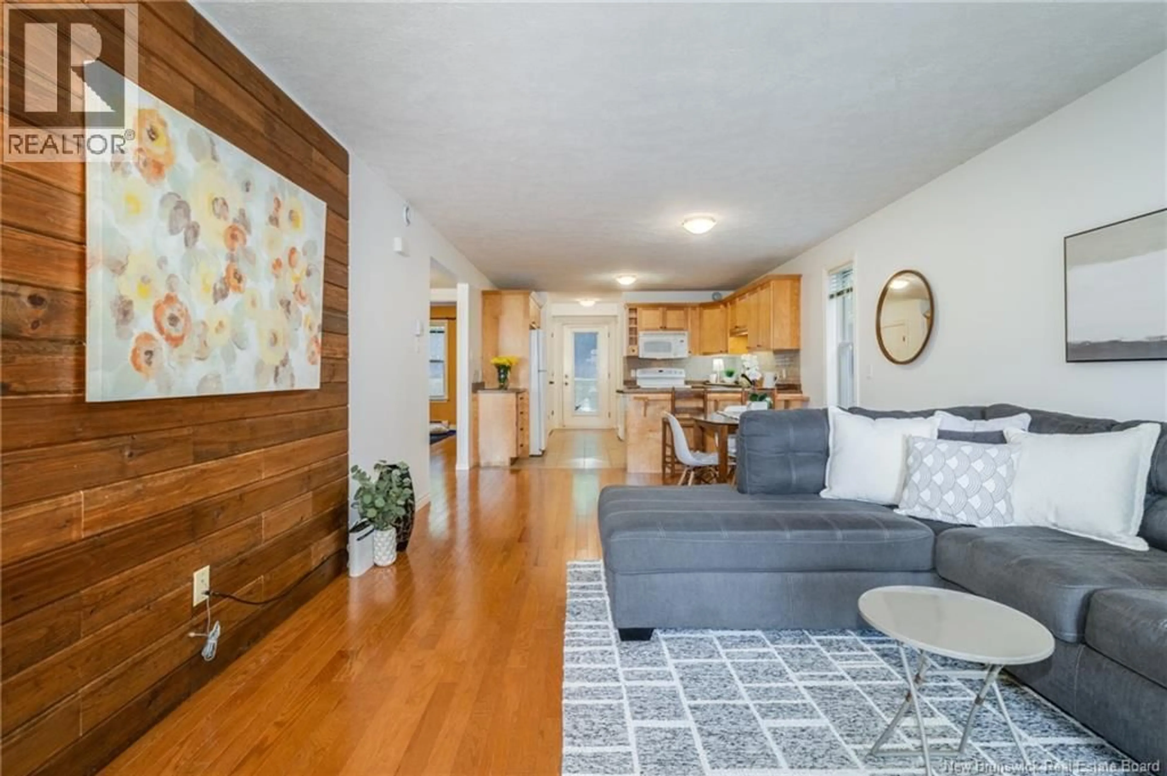 Living room with furniture, wood/laminate floor for 7 - 35 TRAILSIDE LANE, Fredericton New Brunswick E3A1R7