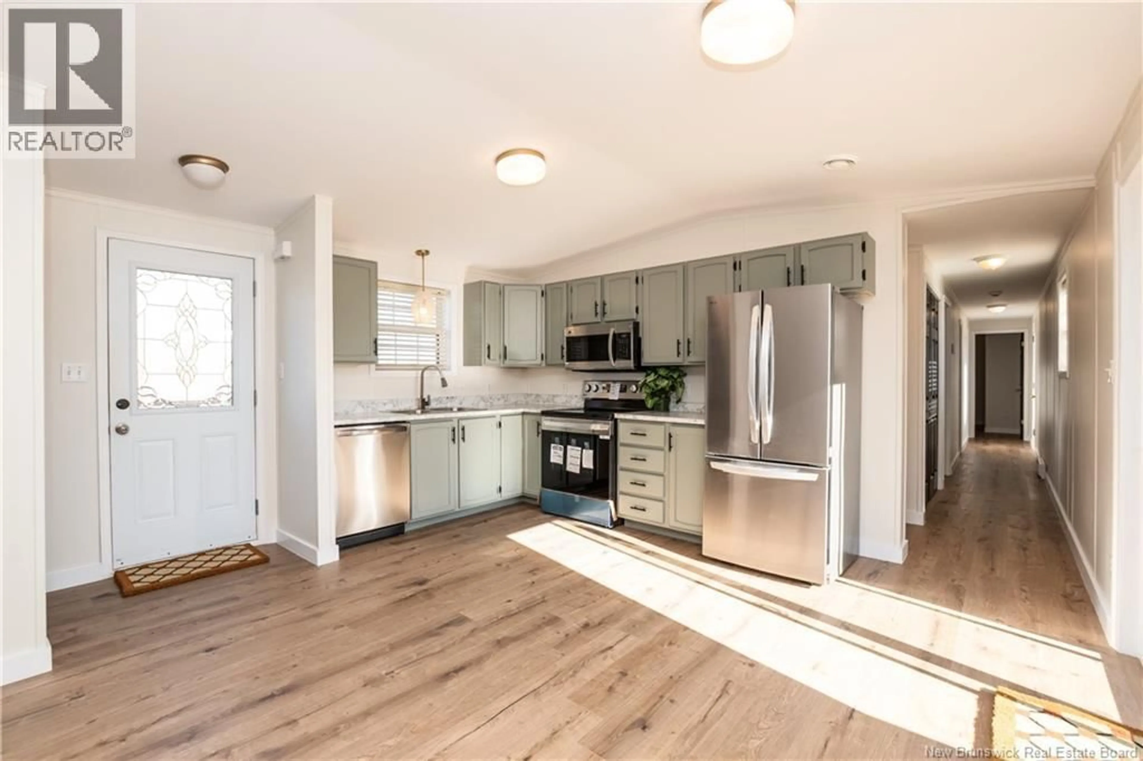 Open concept kitchen, wood/laminate floor for 17 CROSS CREEK LANE, Riverview New Brunswick E1B5H9