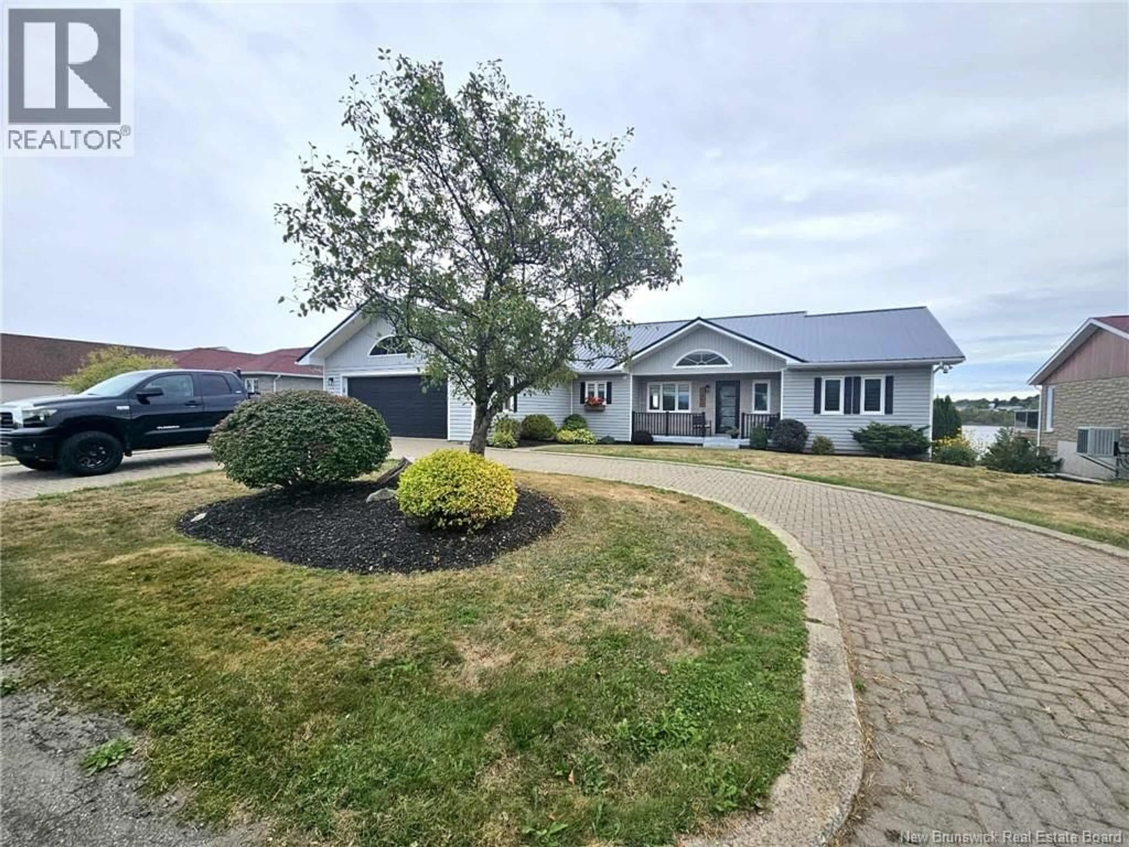 A pic from outside/outdoor area/front of a property/back of a property/a pic from drone, unknown for 1295 RIVERSIDE, Bathurst New Brunswick E2A4X2