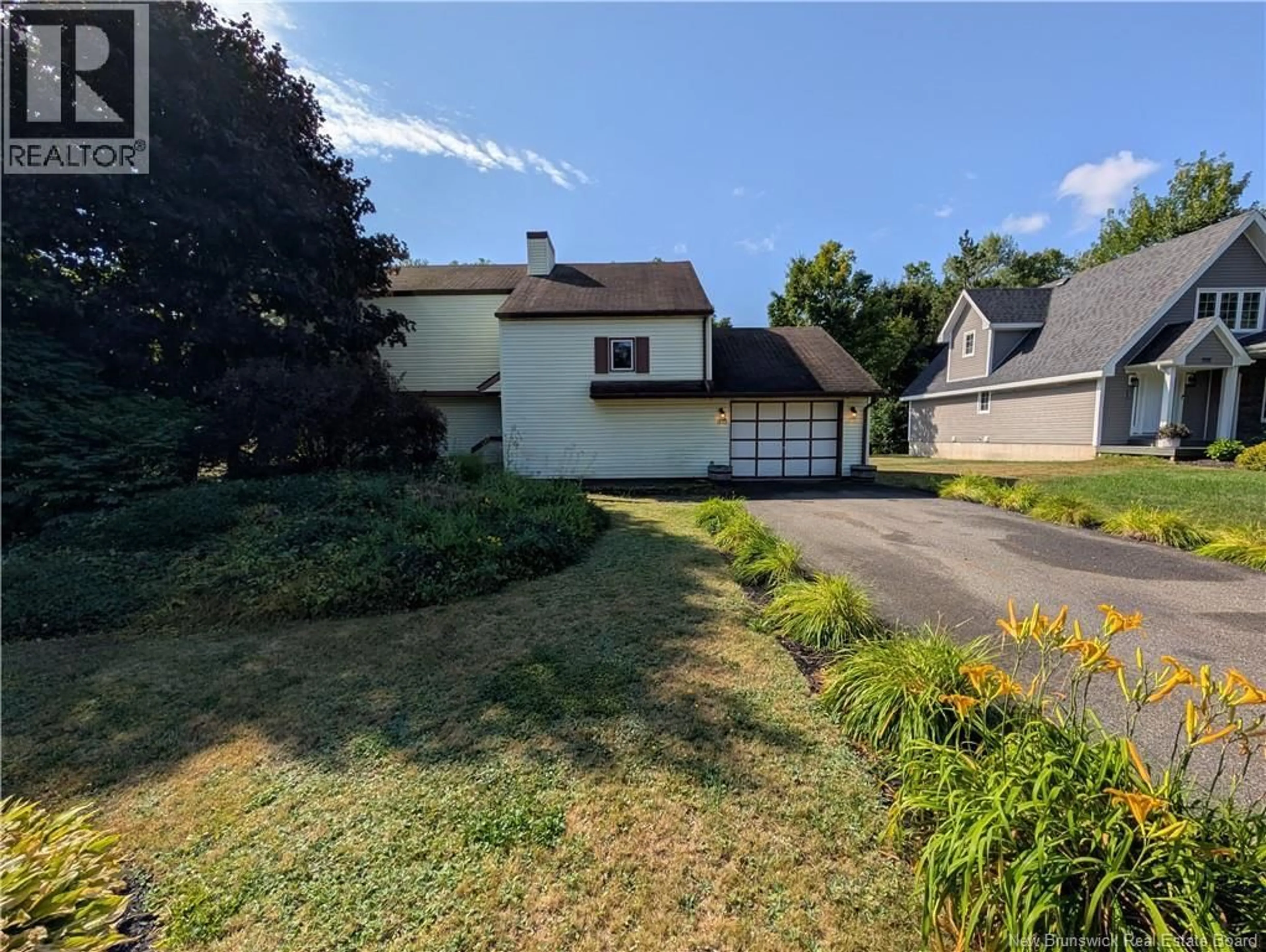 A pic from outside/outdoor area/front of a property/back of a property/a pic from drone, street for 975 TAMARACK DRIVE, Bathurst New Brunswick E2A4G1