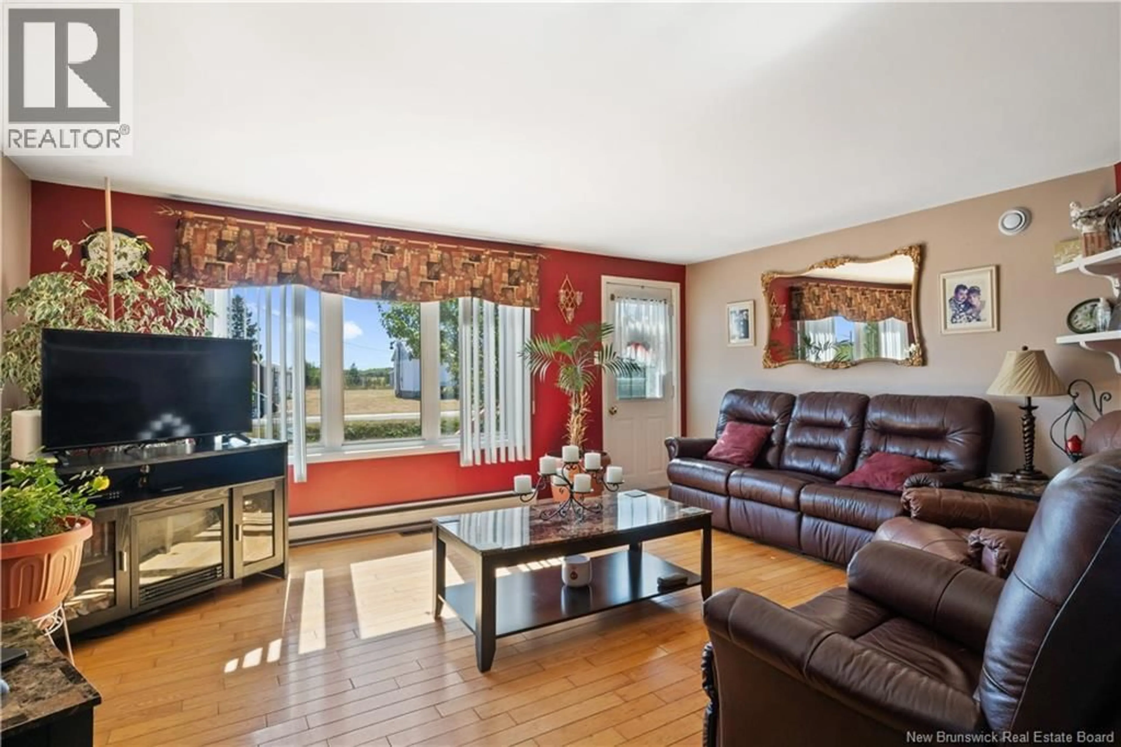 Living room with furniture, wood/laminate floor for 261 CAP SAINT-LOUIS ROAD, Saint-Louis-De-Kent New Brunswick E4X1P6