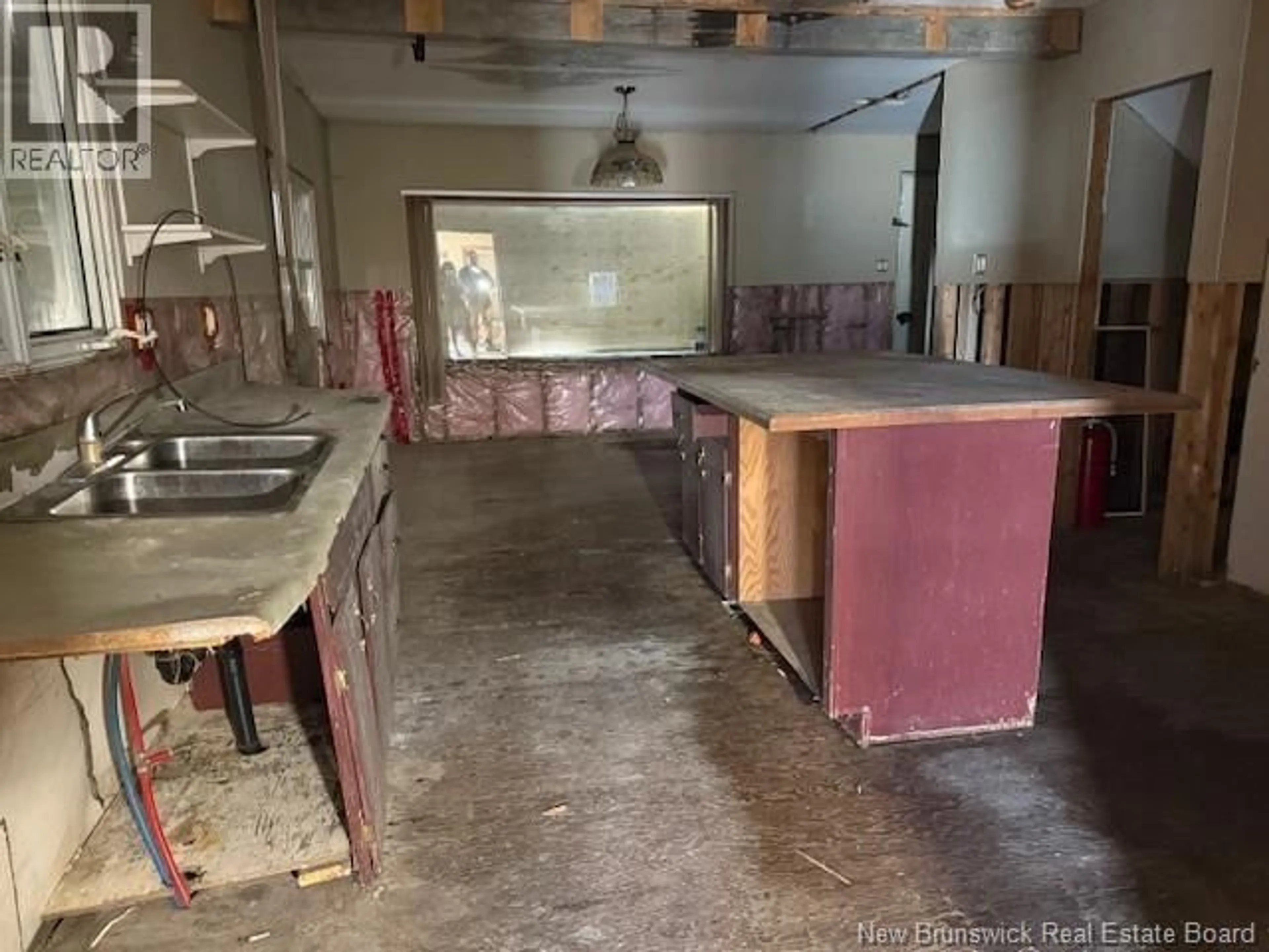 Kitchen with laundary machines, cement floor for 2359 ROUTE 105, Sheffield New Brunswick E3A9K4