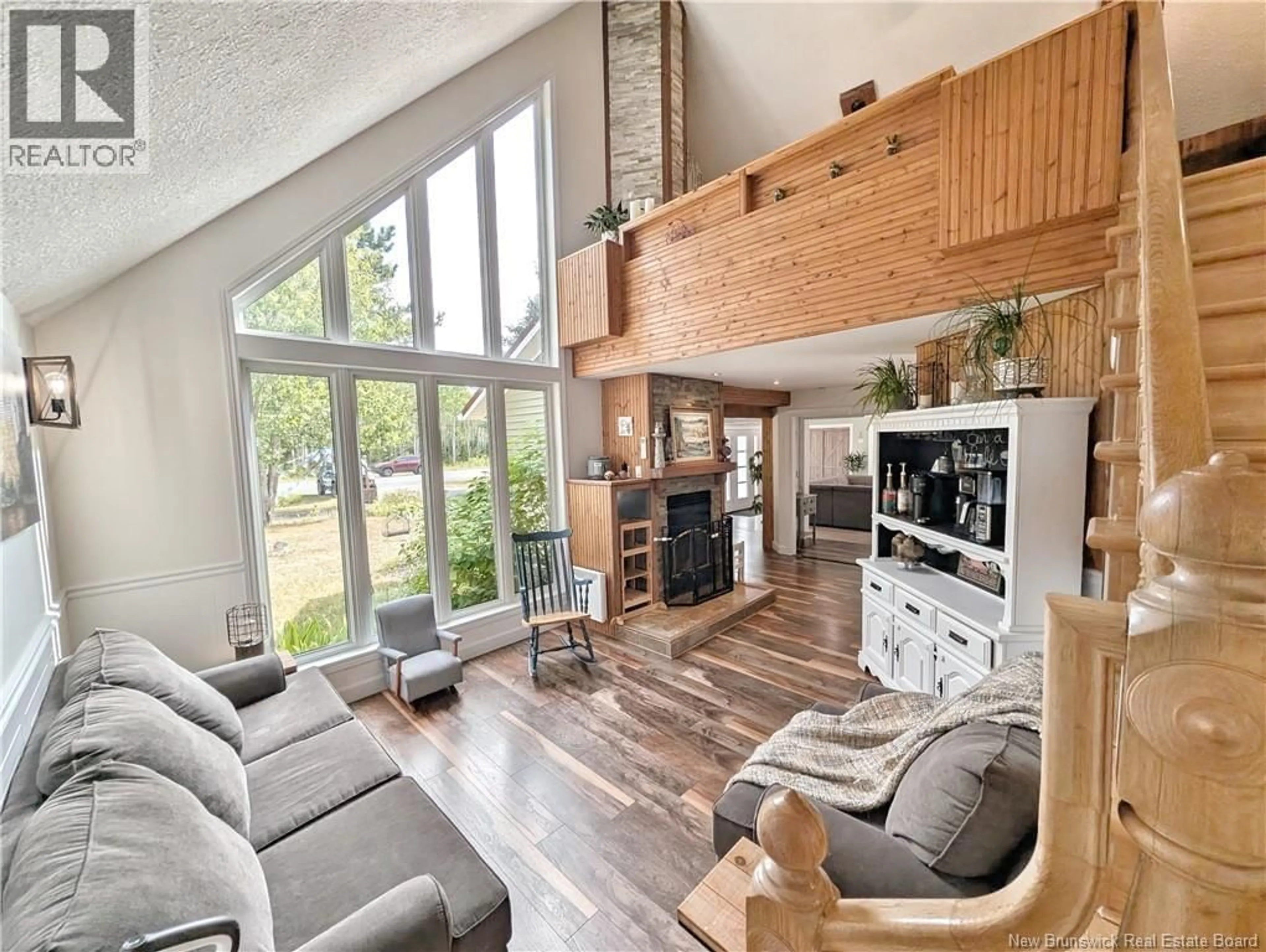 Living room with furniture, wood/laminate floor for 11185 NB 11, Pokemouche New Brunswick E8P1H8