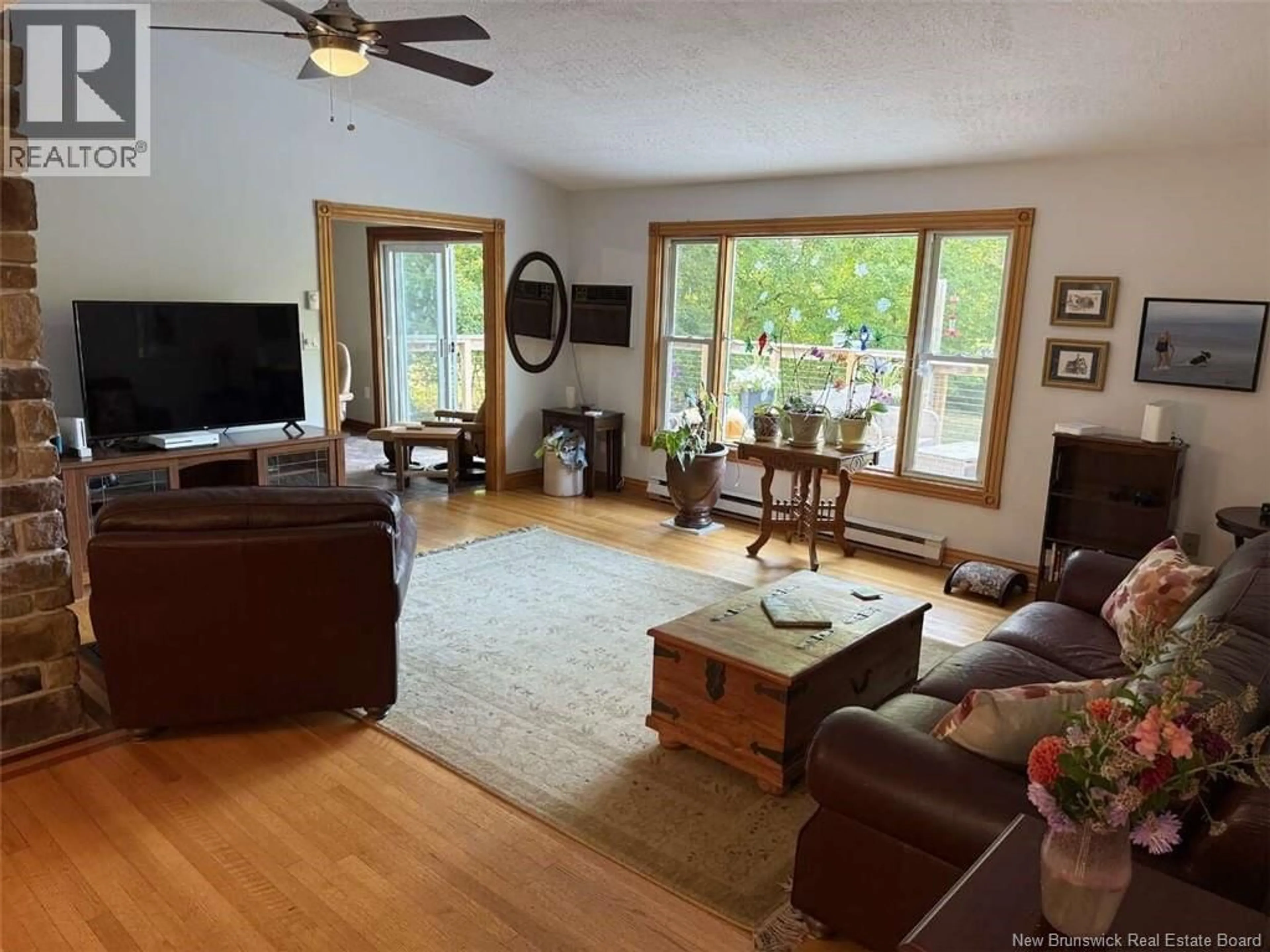 Living room with furniture, wood/laminate floor for 90 GRAHAM DRIVE, Hanwell New Brunswick E3E1A2