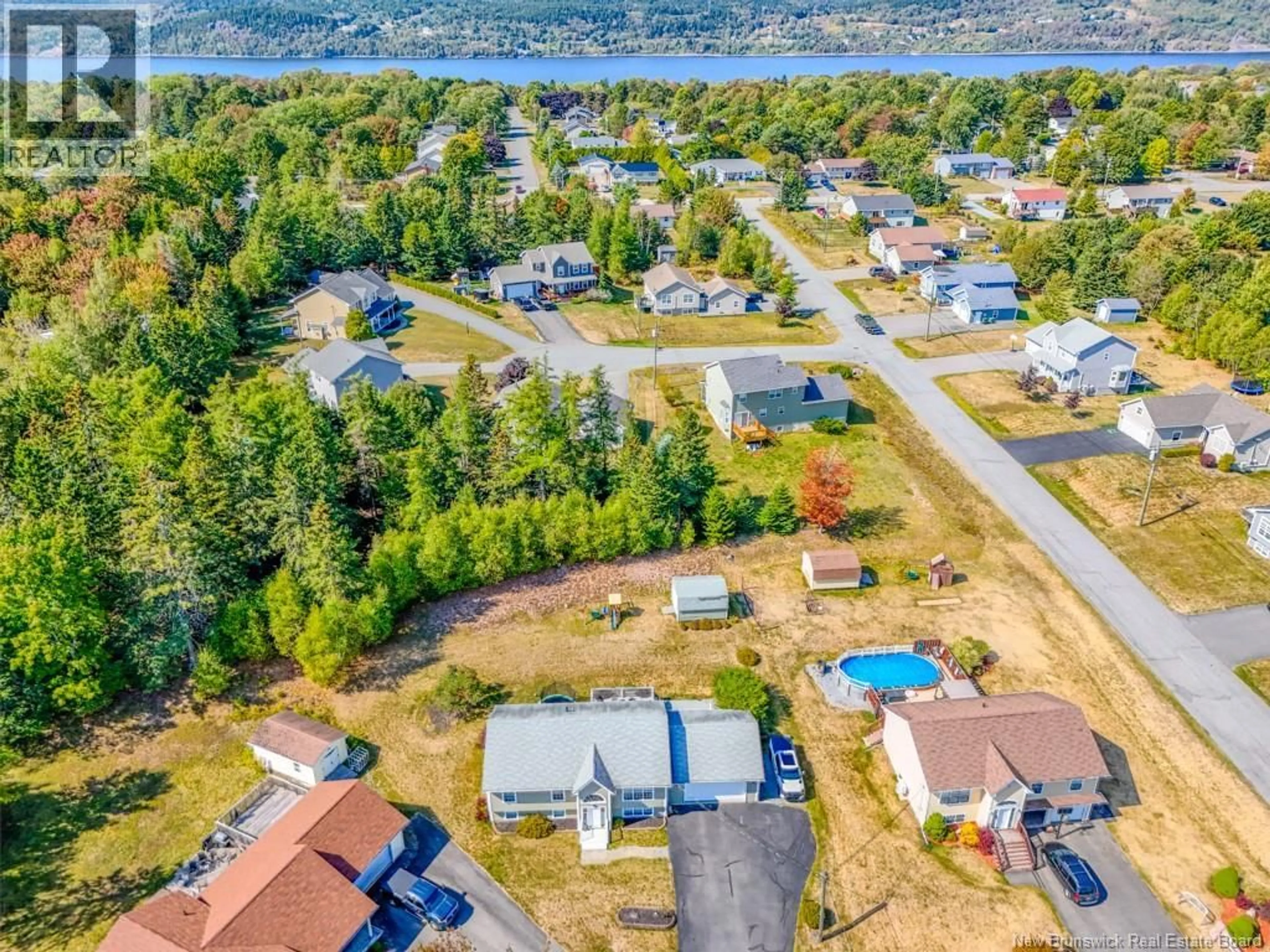 A pic from outside/outdoor area/front of a property/back of a property/a pic from drone, water/lake/river/ocean view for 8 AZALEA COURT, Quispamsis New Brunswick E2E0A6