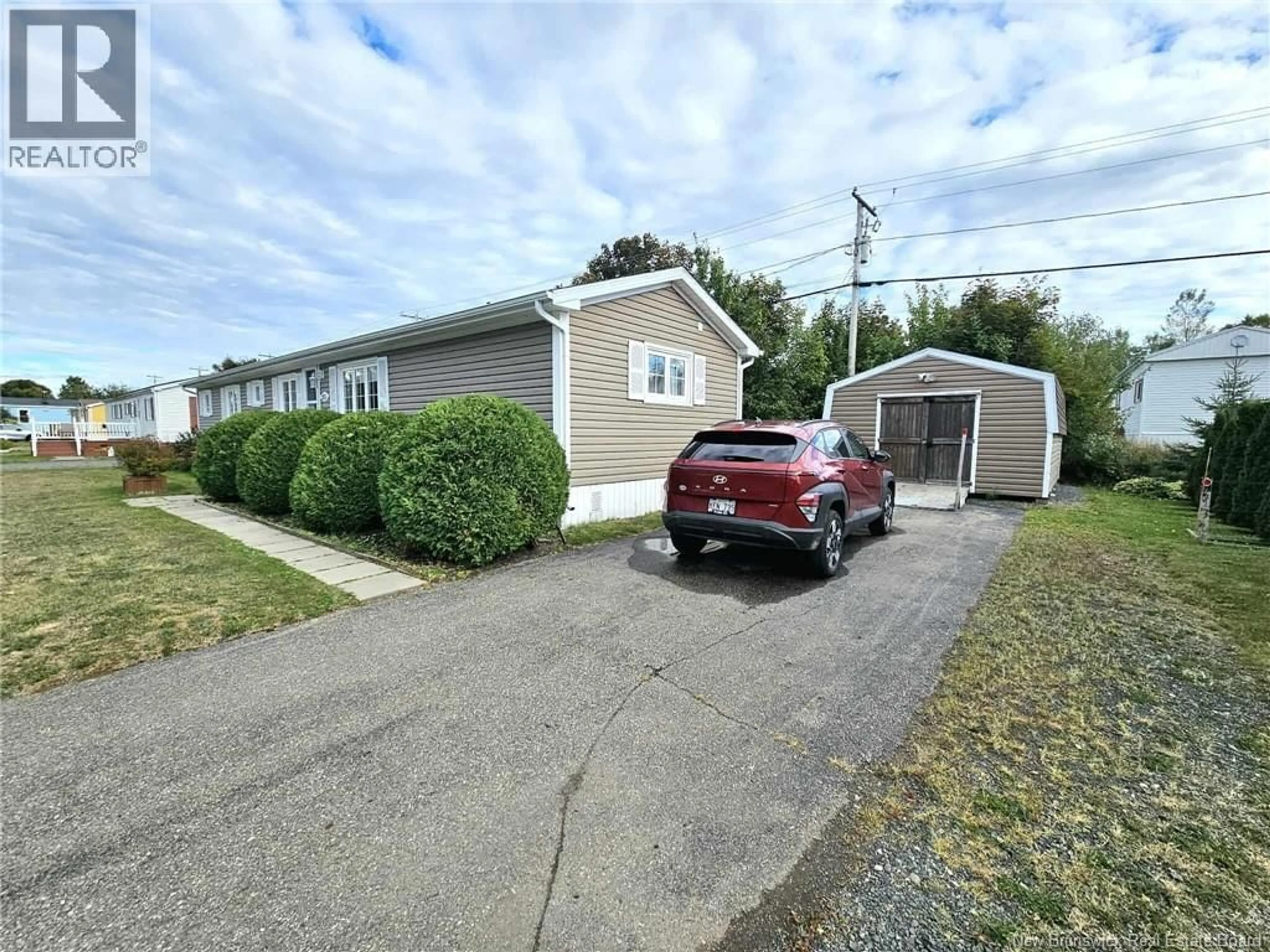 A pic from outside/outdoor area/front of a property/back of a property/a pic from drone, street for 253 BIRCHGROVE, Beresford New Brunswick E8K1E9