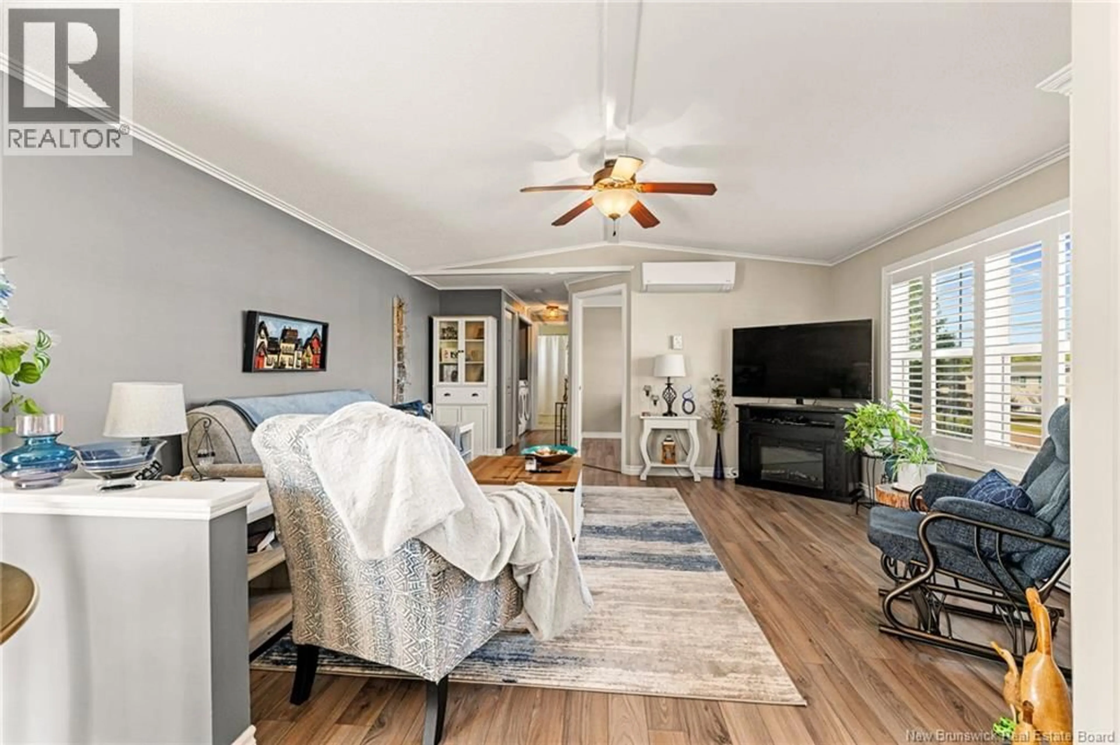 Living room with furniture, wood/laminate floor for 9 GENTIAN, Moncton New Brunswick E1H3K9