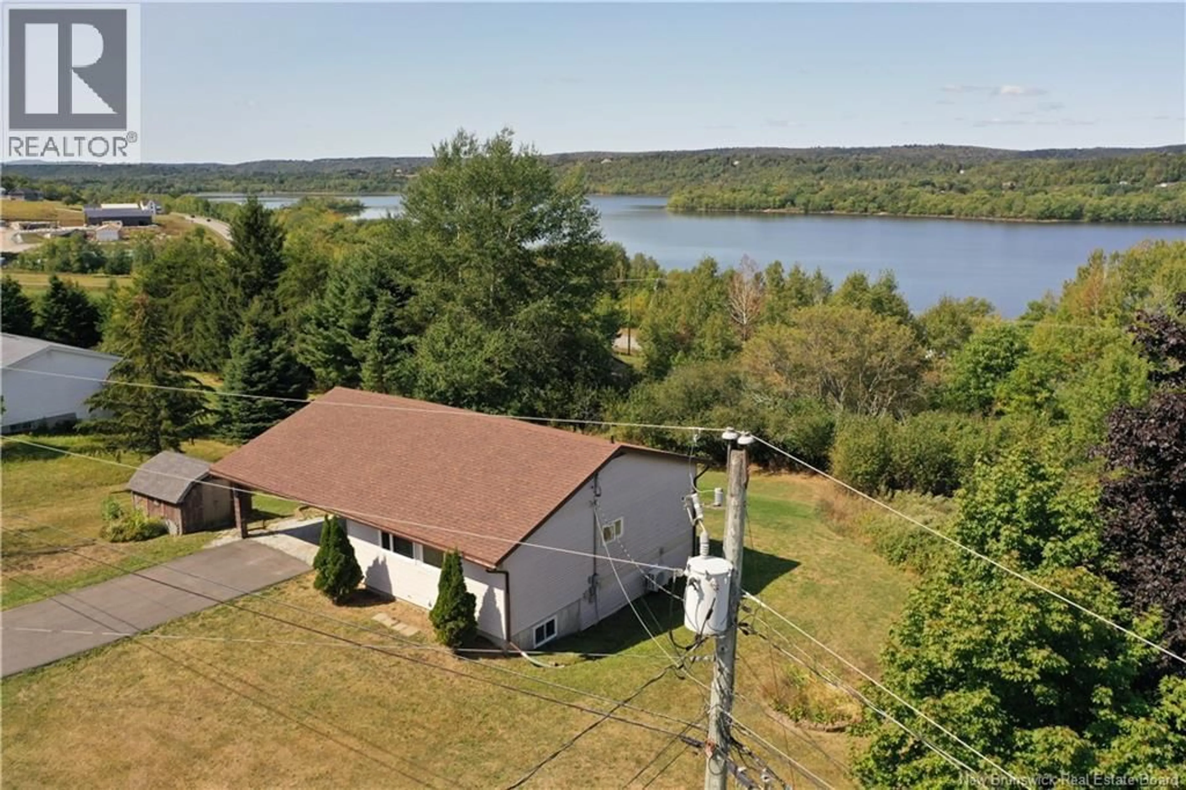 A pic from outside/outdoor area/front of a property/back of a property/a pic from drone, water/lake/river/ocean view for 10 GEORGE STREET, Nauwigewauk New Brunswick E5N6T7