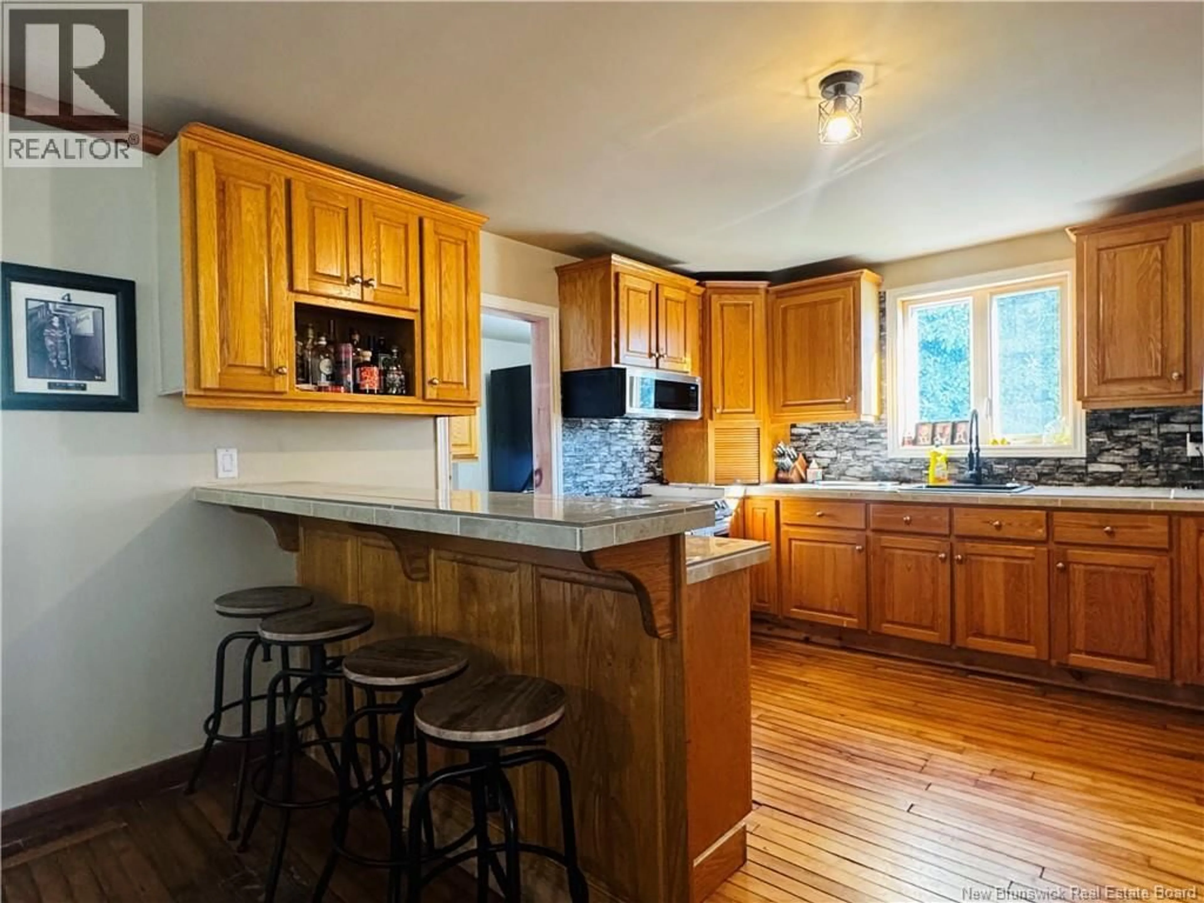 Open concept kitchen, wood/laminate floor for 5657 ROUTE 340, Haut-Paquetville New Brunswick E8R1T1