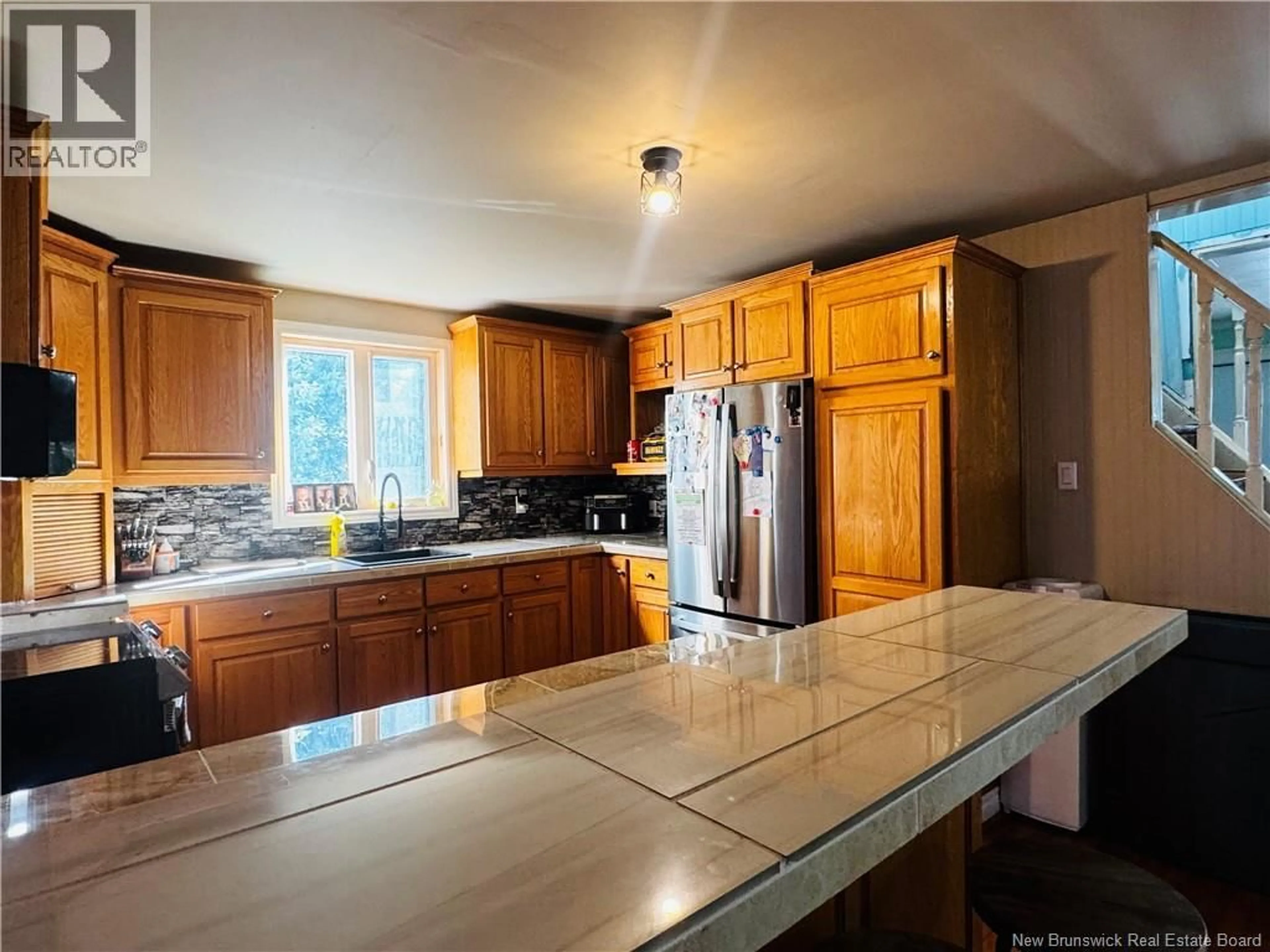 Open concept kitchen, ceramic/tile floor for 5657 ROUTE 340, Haut-Paquetville New Brunswick E8R1T1