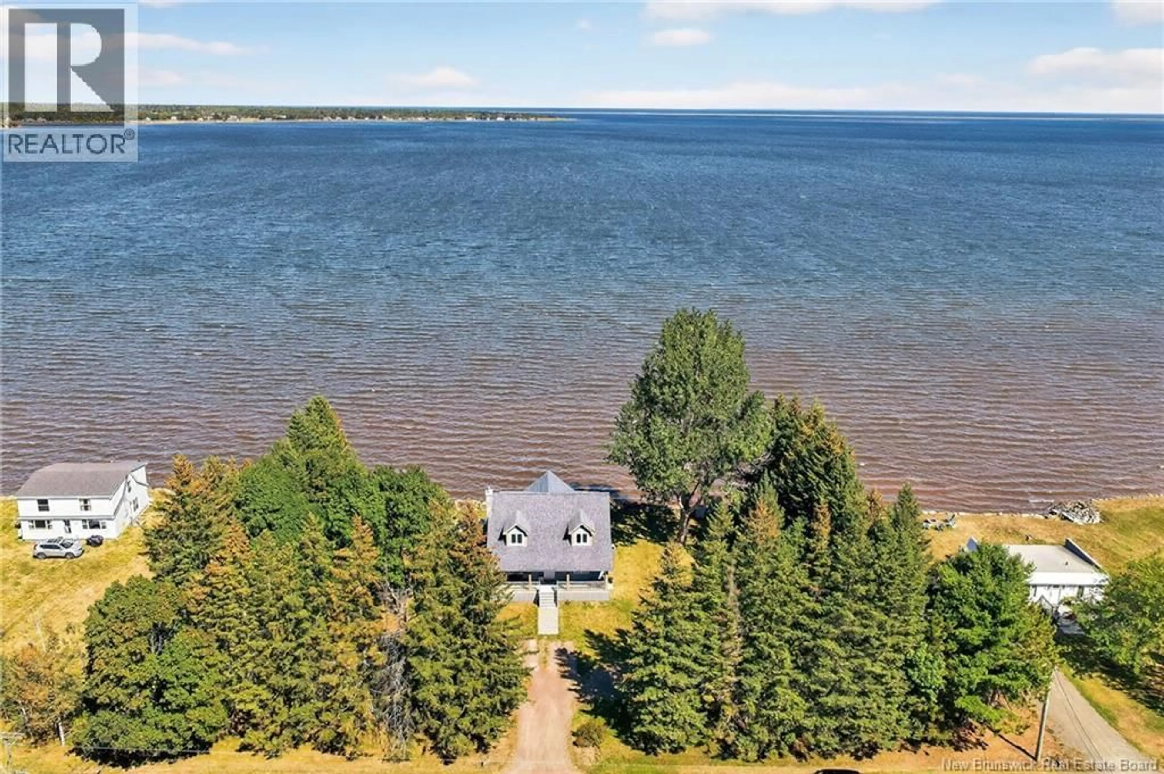 A pic from outside/outdoor area/front of a property/back of a property/a pic from drone, water/lake/river/ocean view for 101 LOUIS BOURG, Bouctouche New Brunswick E4S3N6