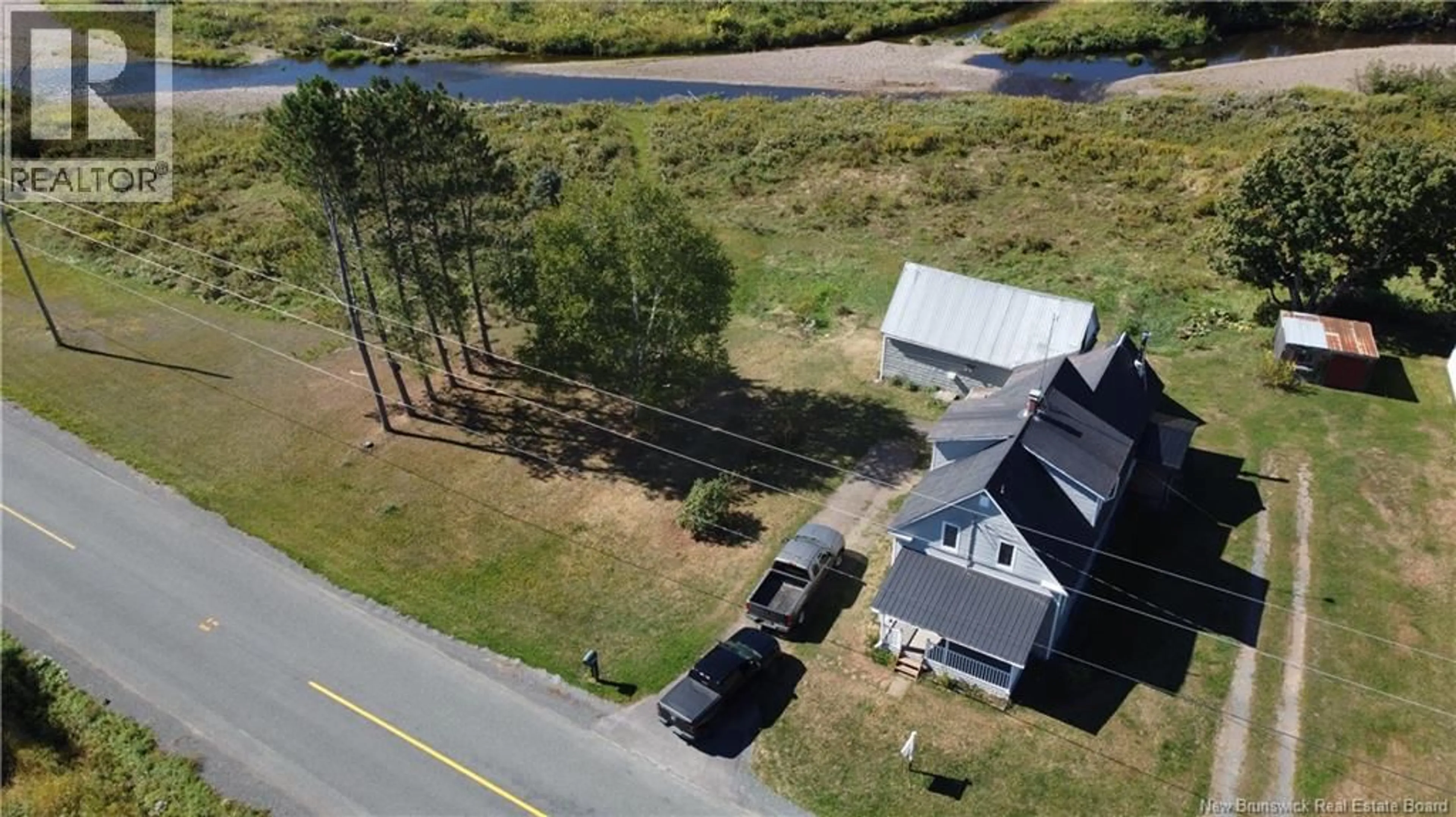 A pic from outside/outdoor area/front of a property/back of a property/a pic from drone, water/lake/river/ocean view for 6369 104 ROUTE, Cloverdale New Brunswick E7P1X5