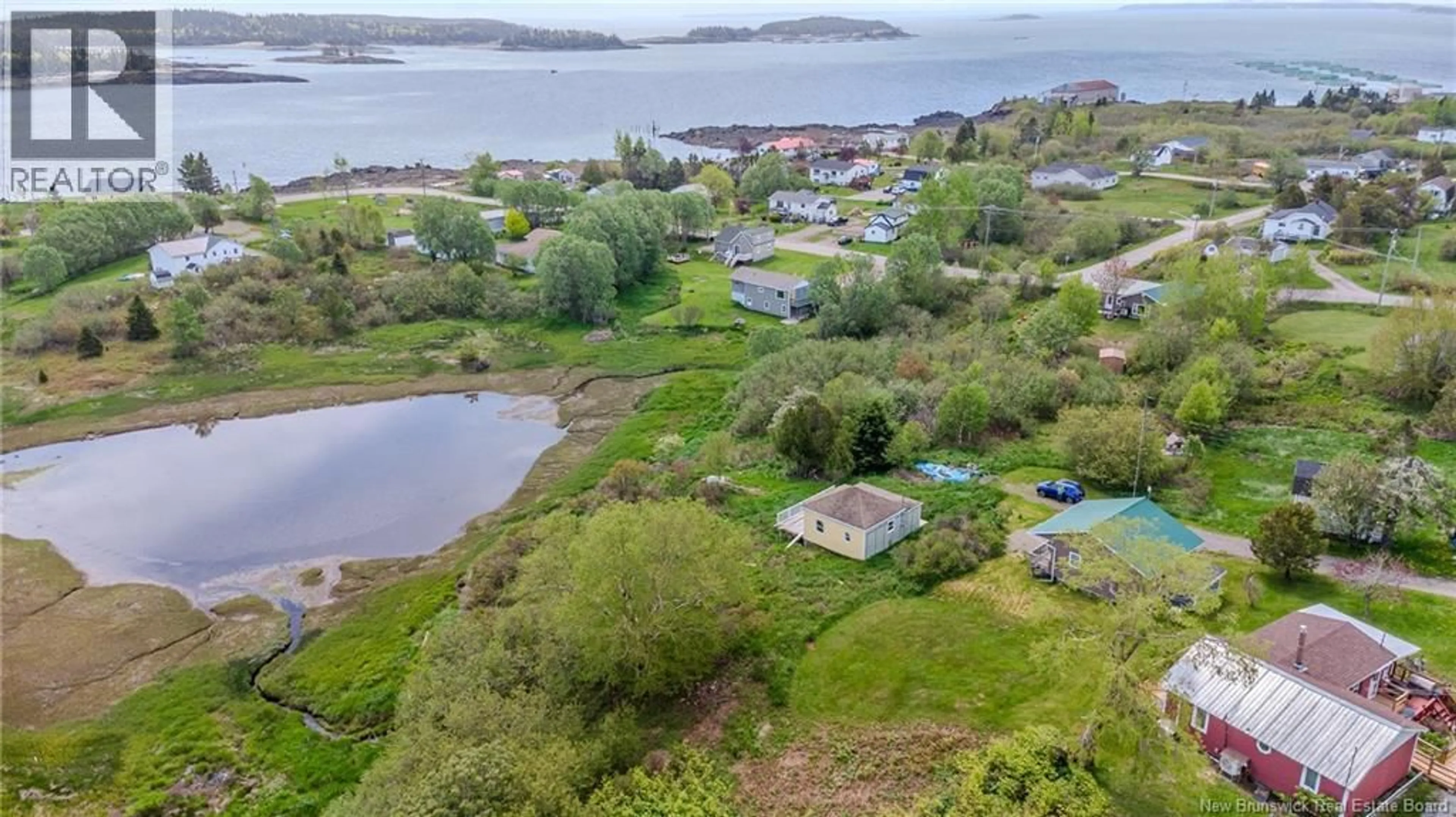 A pic from outside/outdoor area/front of a property/back of a property/a pic from drone, water/lake/river/ocean view for 15 FUNDY VIEW DRIVE, Back Bay New Brunswick E5C2X8