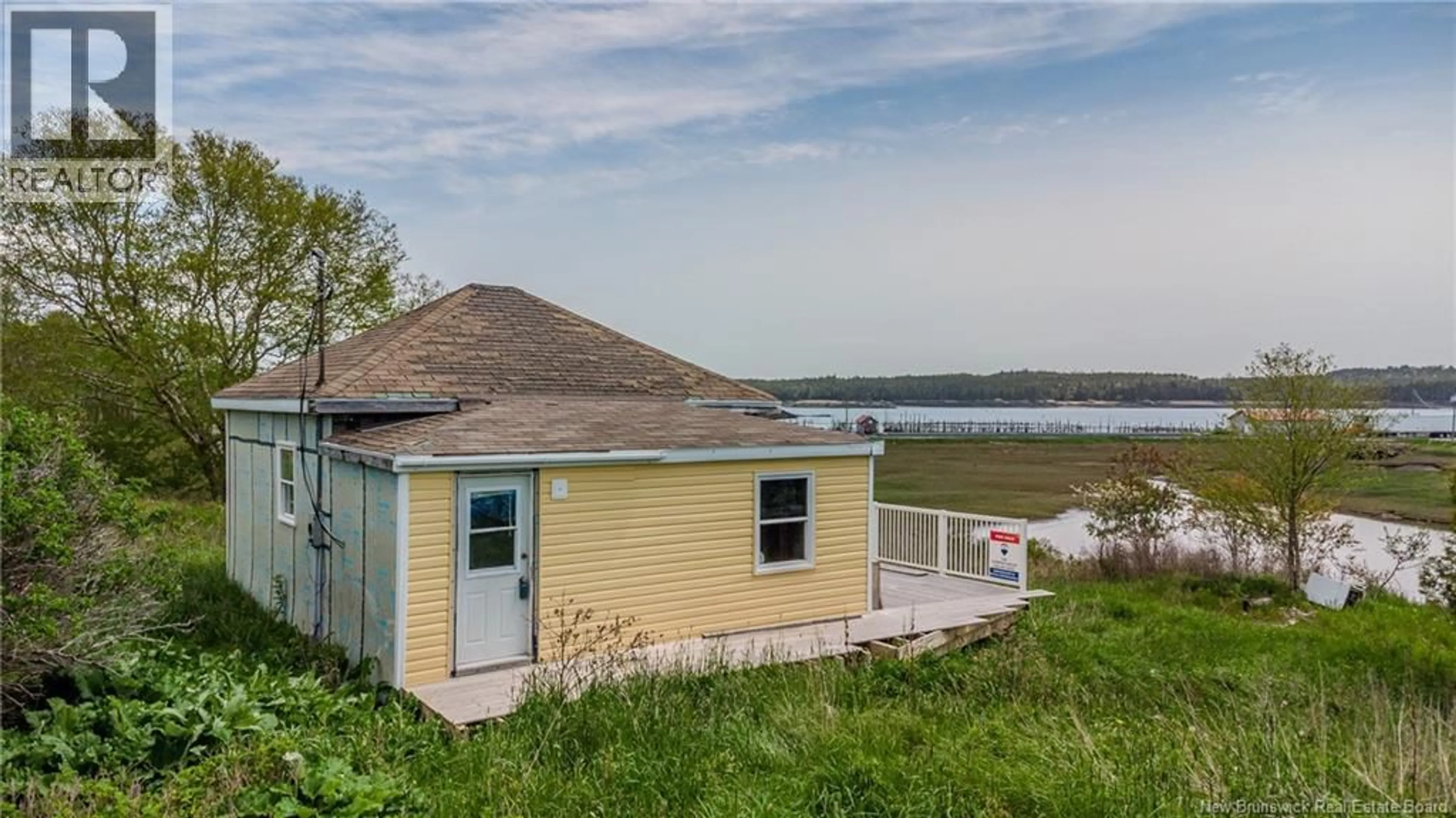A pic from outside/outdoor area/front of a property/back of a property/a pic from drone, water/lake/river/ocean view for 15 FUNDY VIEW DRIVE, Back Bay New Brunswick E5C2X8