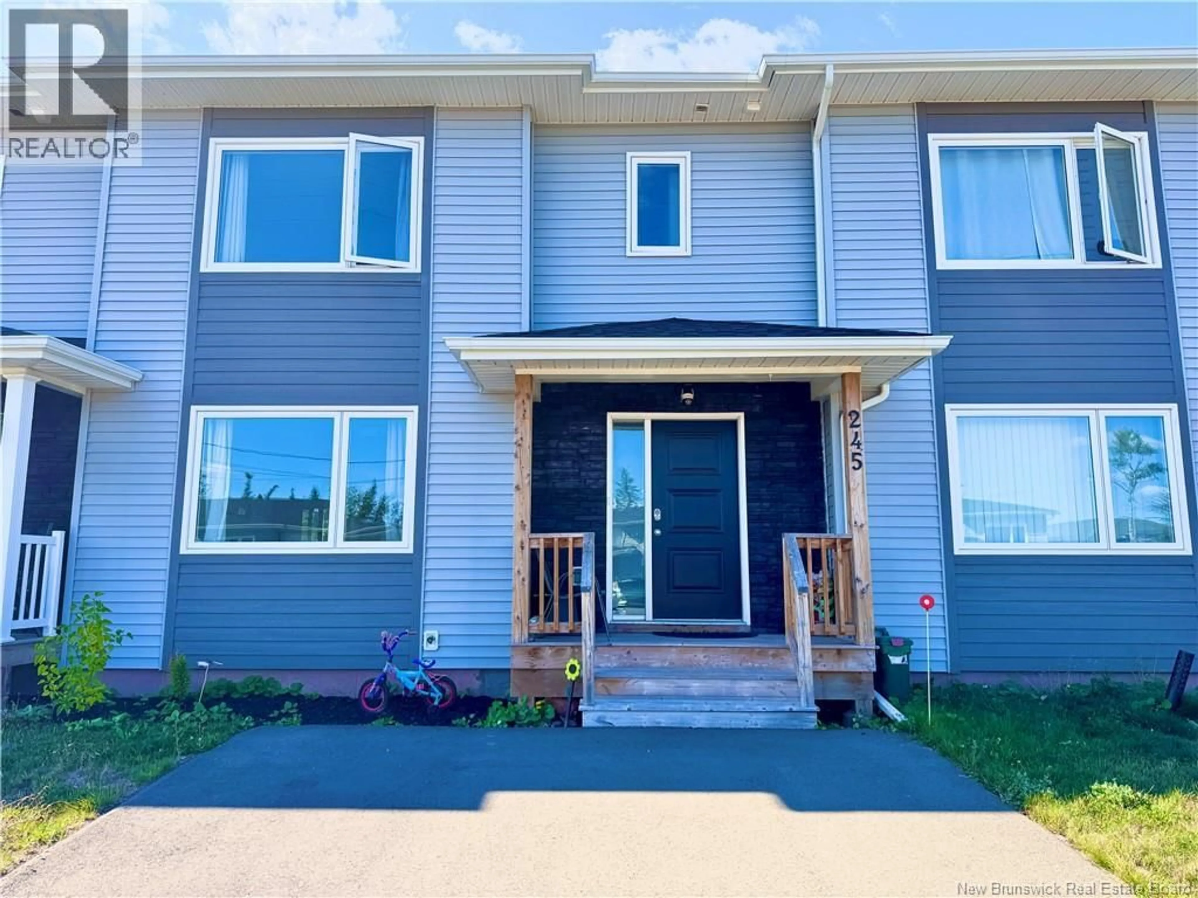 Home with vinyl exterior material, street for 245 FALCON DRIVE, Moncton New Brunswick E1G6H3