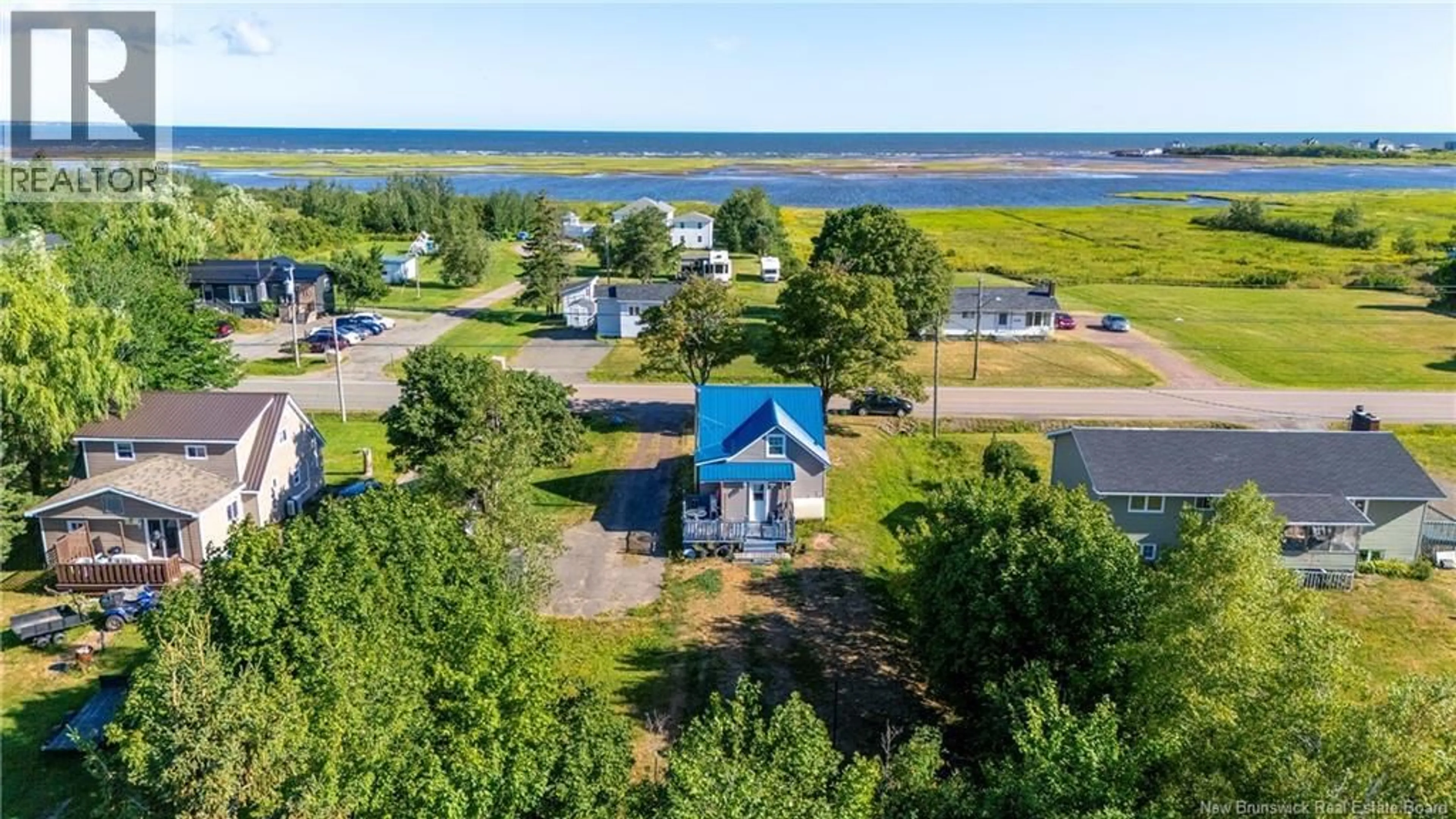 A pic from outside/outdoor area/front of a property/back of a property/a pic from drone, water/lake/river/ocean view for 1179 ROUTE 133, Grand-Barachois New Brunswick E4P8C5